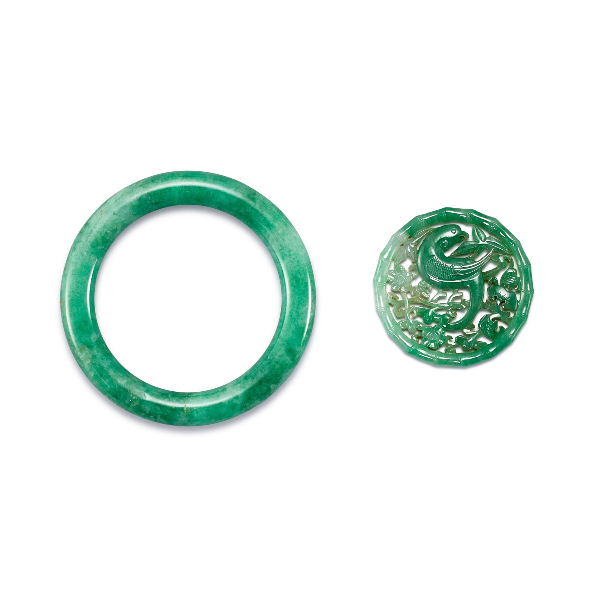 A jadeite bangle and a reticulated 'bird and flower' pendant, — A jadeite bangle and a reticulated 'bird and flower' pendant, Qing dynasty 清 翠玉手鐲 及 透雕花鳥紋珮