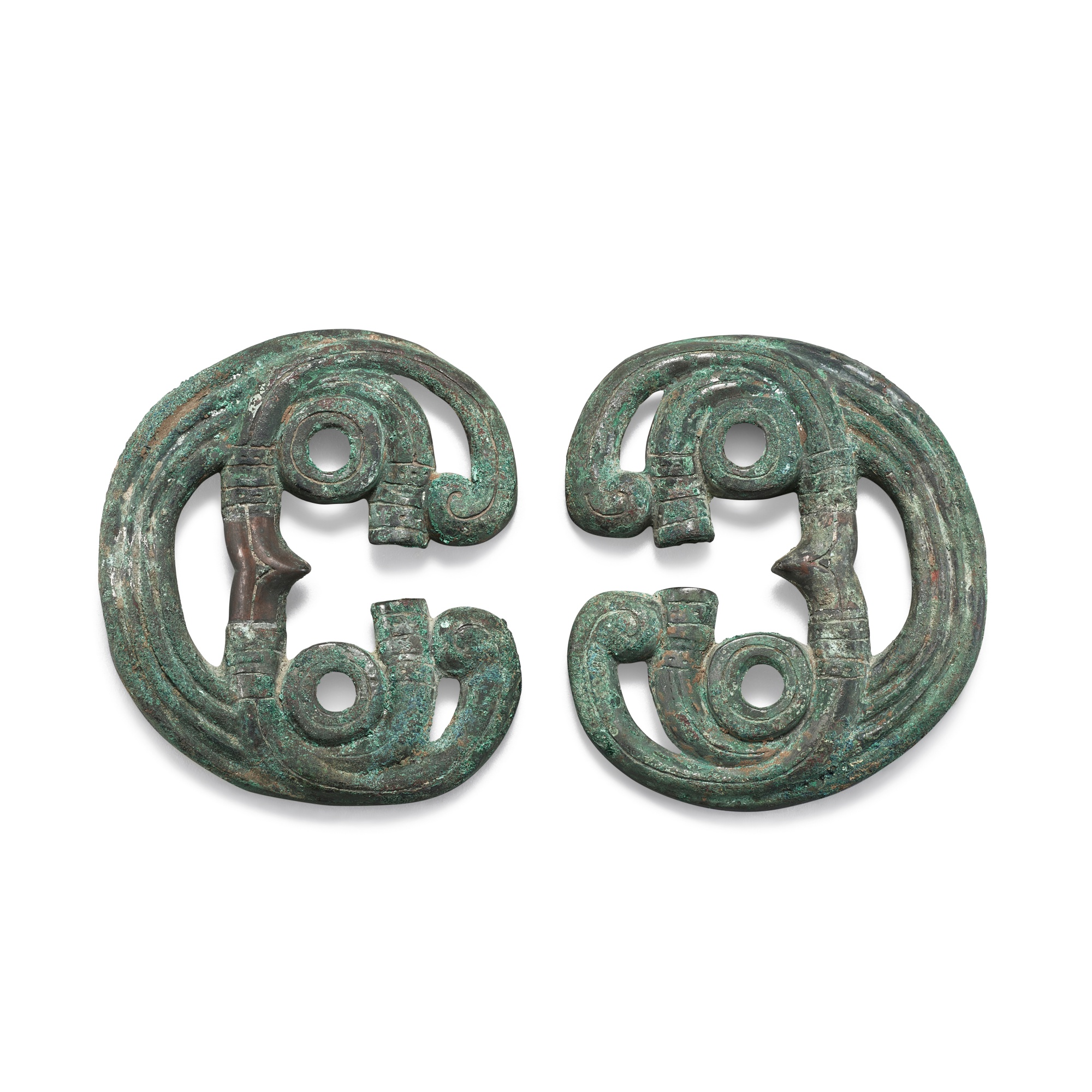 Unknown — A pair of archaic bronze horse bridle ornaments, Mid-Western Zhou dynasty, circa 8th century BC 西周中期約公元前八世紀　青銅馬鑣一對
