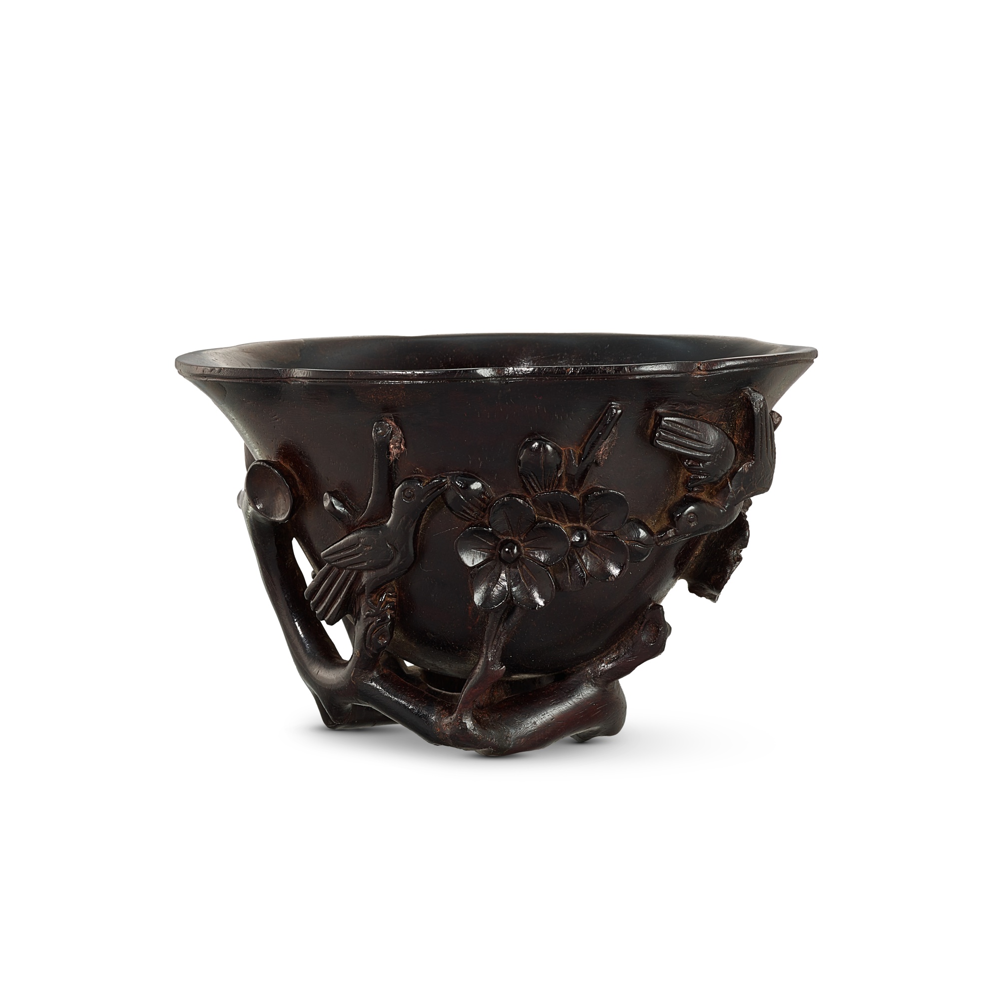A hardwood carved 'prunus and magpie' libation cup, — A hardwood carved 'prunus and magpie' libation cup, Qing dynasty 清 硬木雕喜上眉梢紋角盃