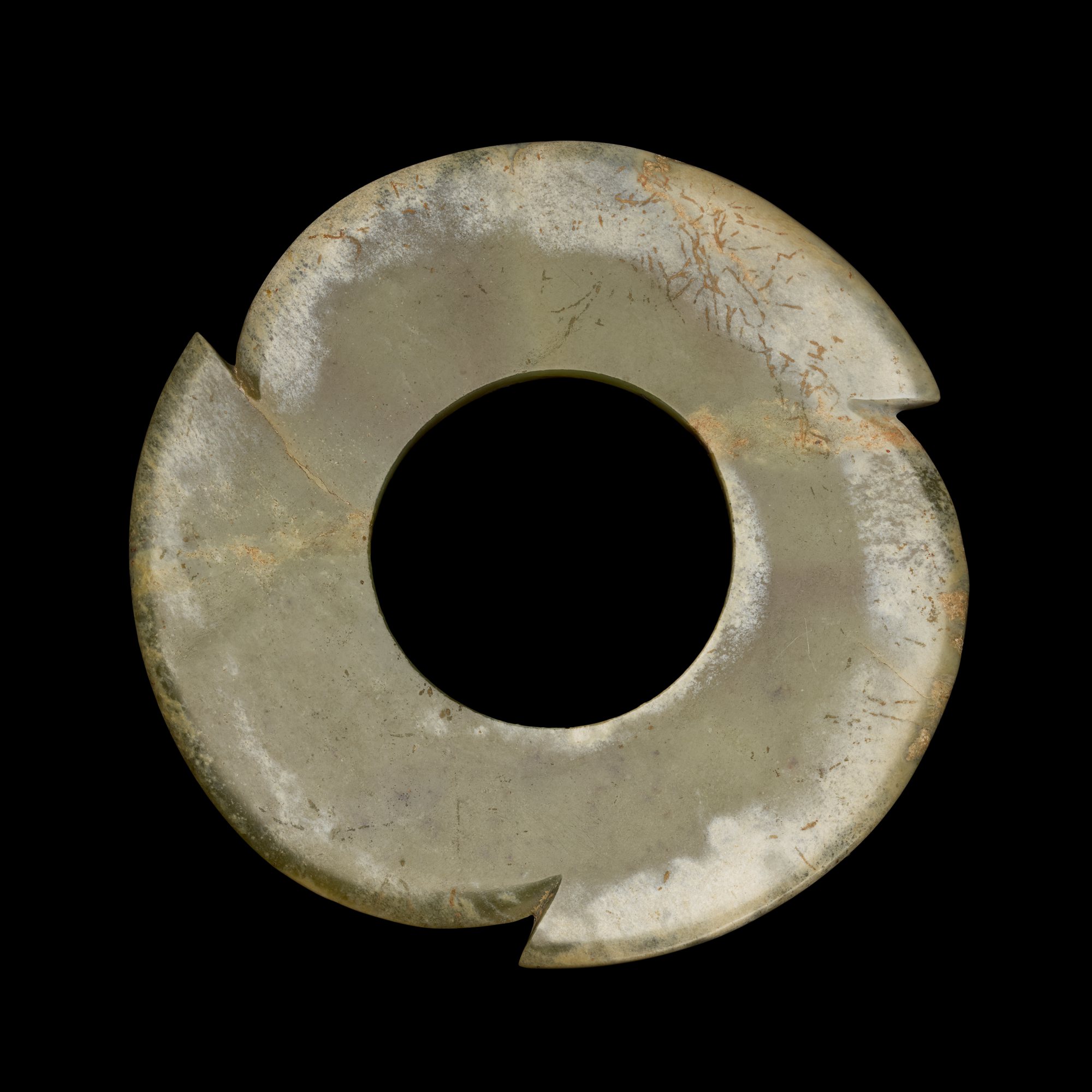 A celadon jade notched disc, — 新石器時代晚期至商 青玉牙璧