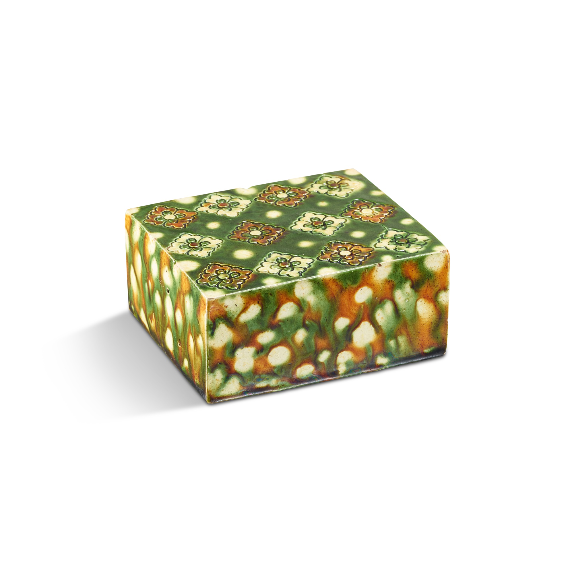 A rare small sancai 'floral' pillow, — A rare small sancai 'floral' pillow, Tang dynasty 唐 三彩印花枕