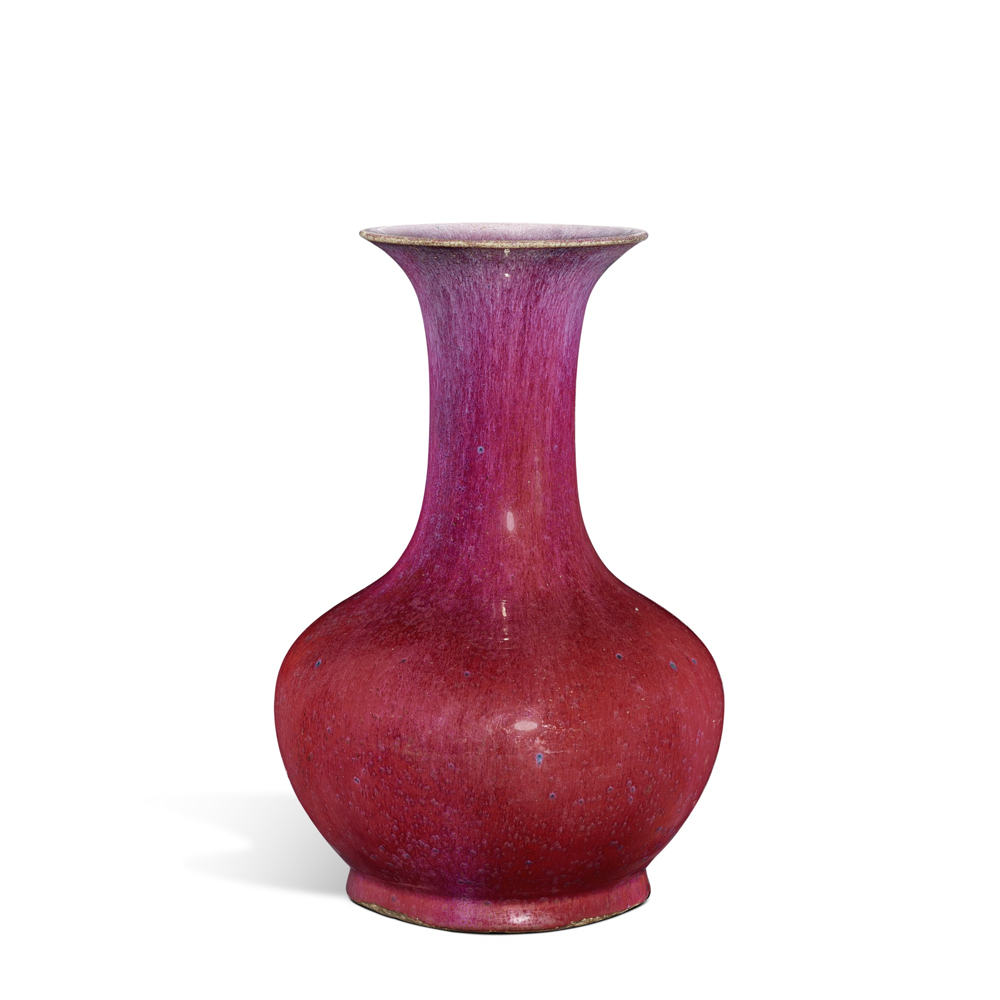 A flambé-glazed bottle vase, — A flambé-glazed bottle vase, Qing dynasty, 18th - 19th century 清十八至十九世紀 窰變釉撇口瓶