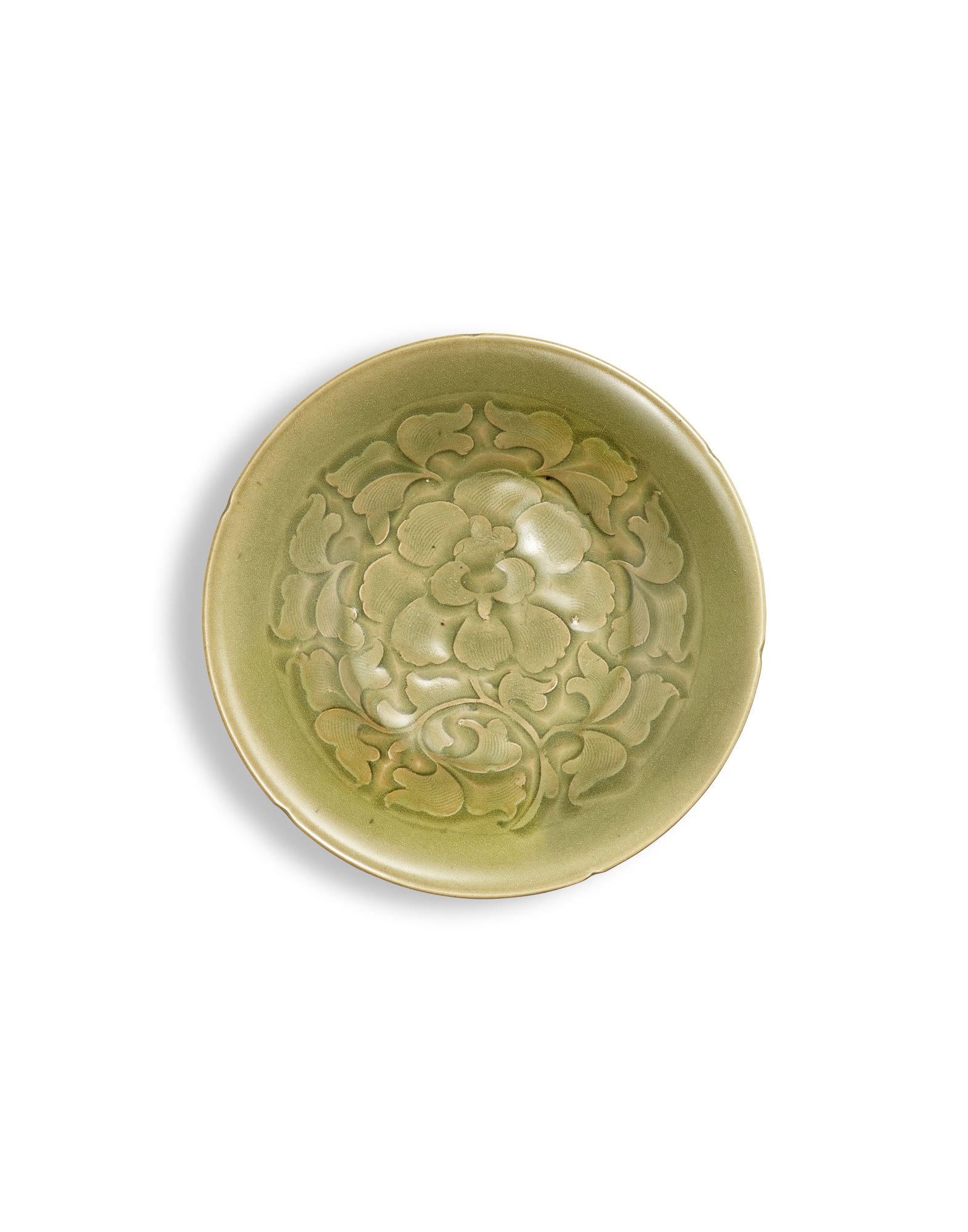 A carved Yaozhou celadon 'peony' dish, — 北宋　耀州青釉刻牡丹紋葵口盤