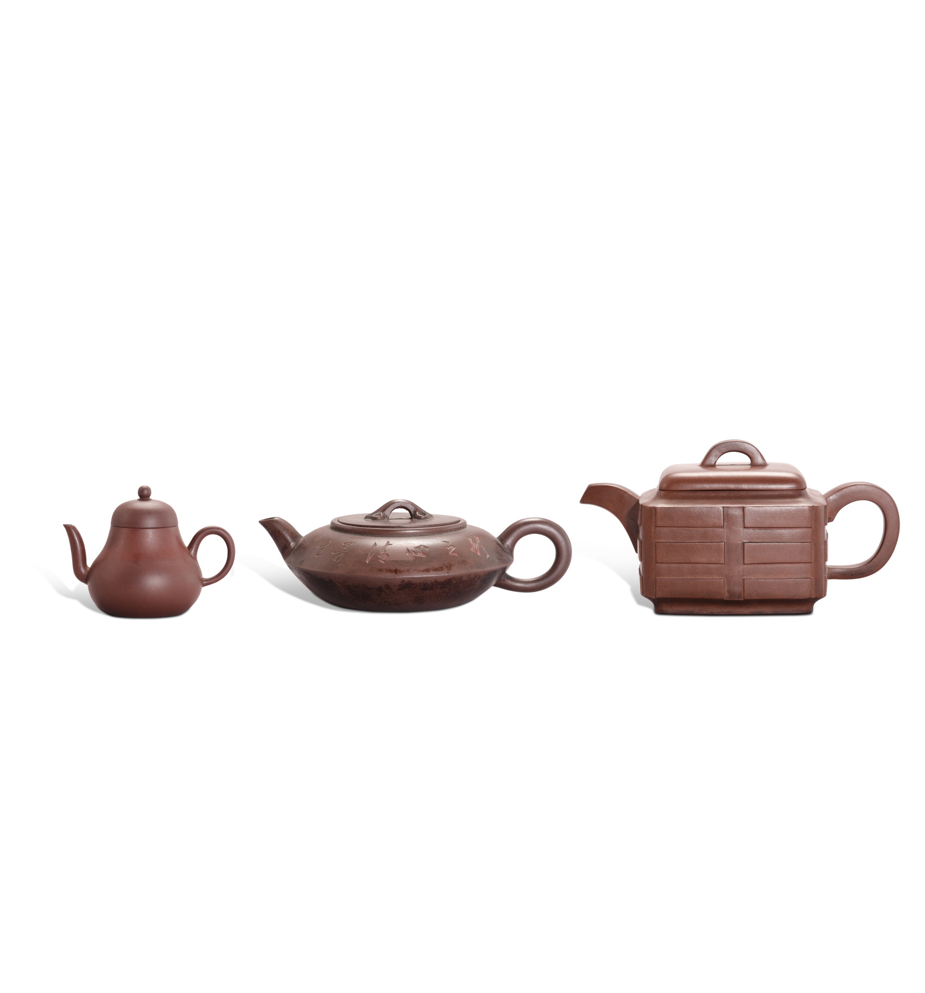 Three inscribed Yixing teapots
