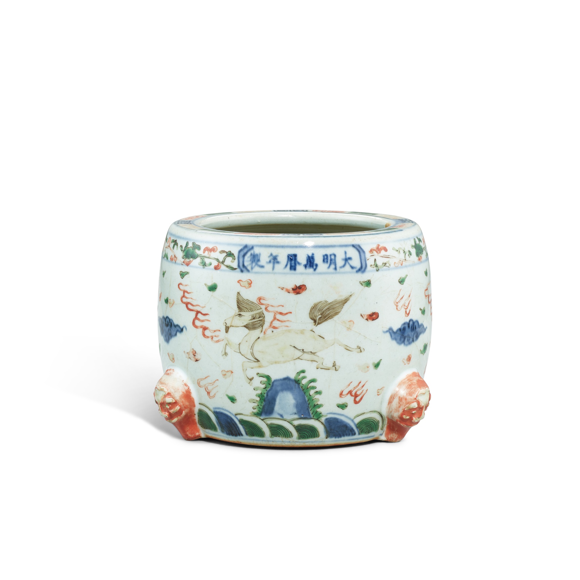 A wucai 'mythical beast' tripod incense burner — 明萬曆 青花五彩海獸紋爐 《大明萬曆年製》款