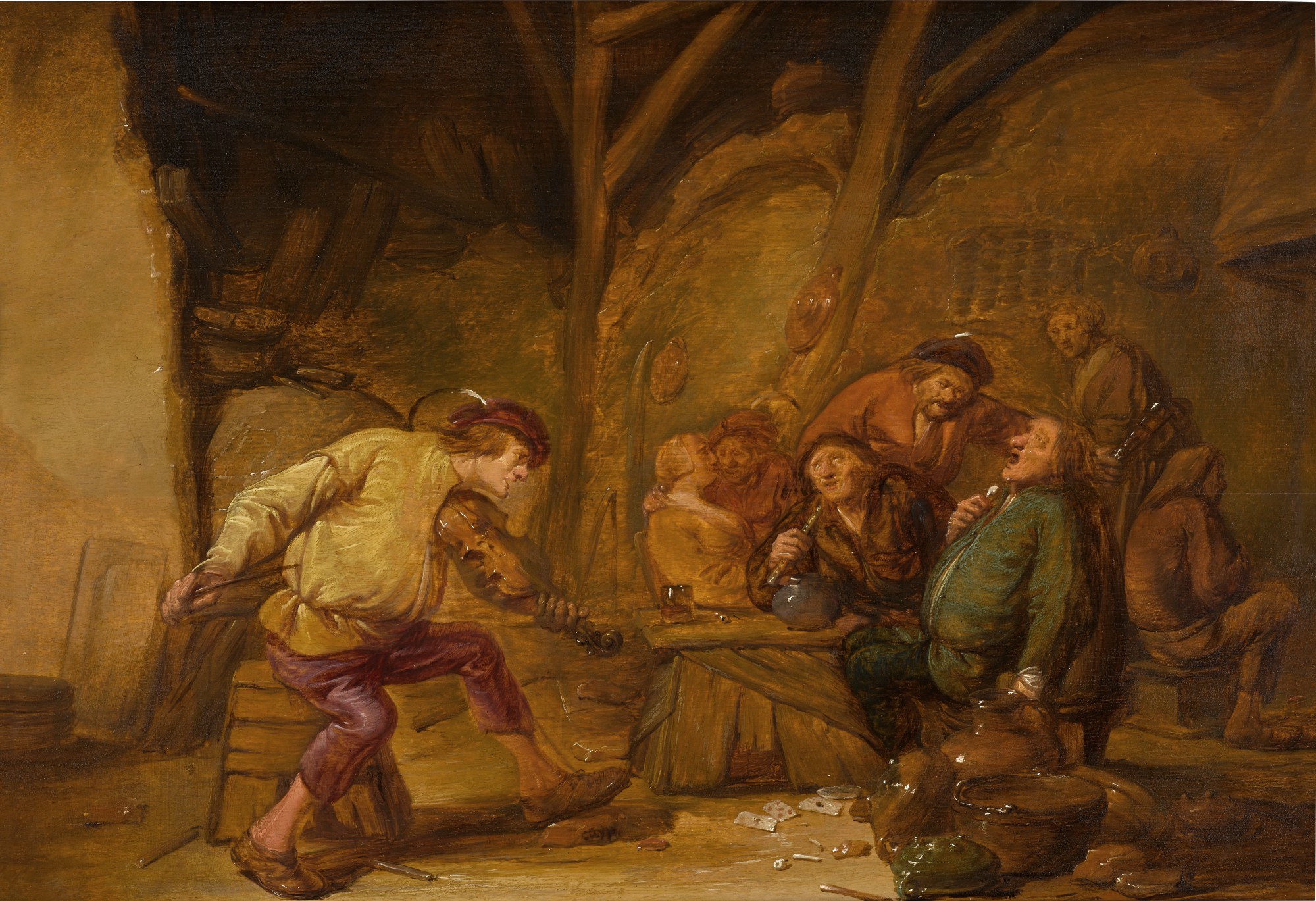 Peasants merry-making in a barn