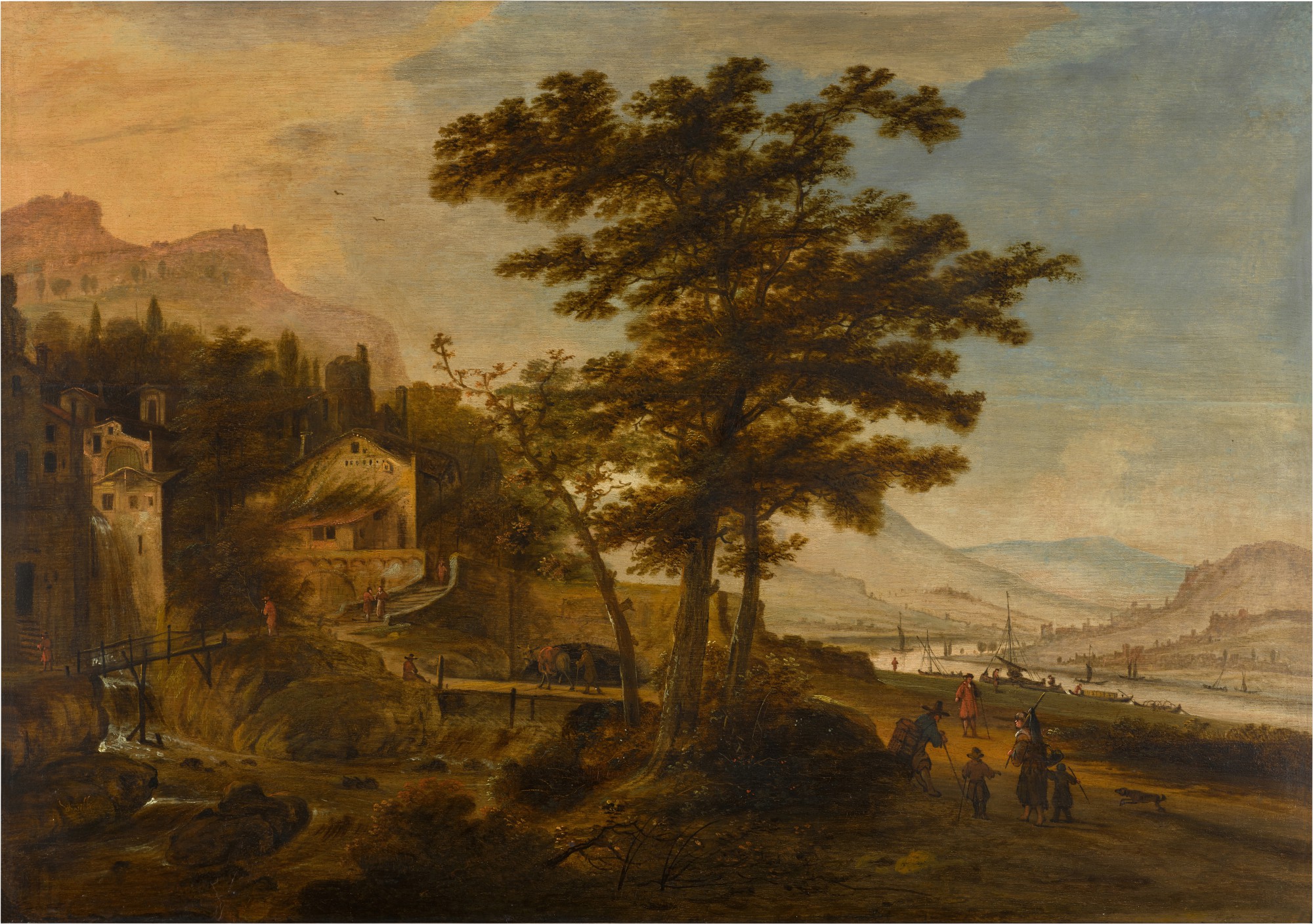 An extensive mountainous and river landscape with a village
