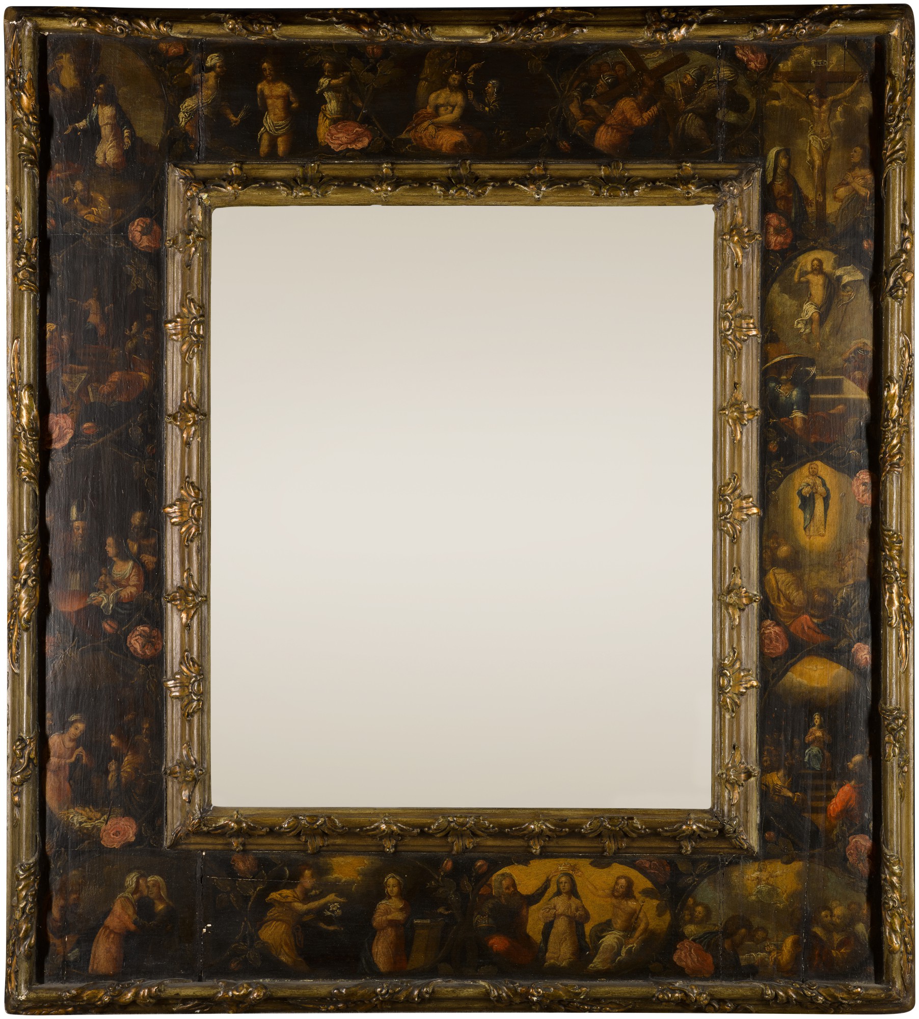A mirror with a frame depicting scenes from the life of Christ and the life of the Virgin Mary