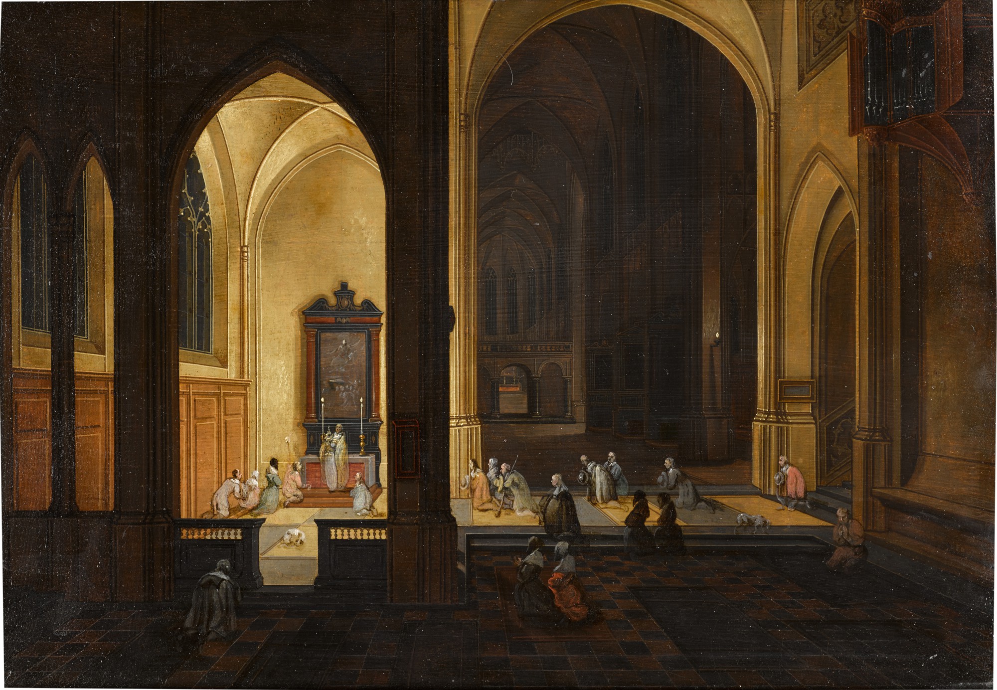 The interior of a gothic church by night, with a priest conducting a service in a side chapel