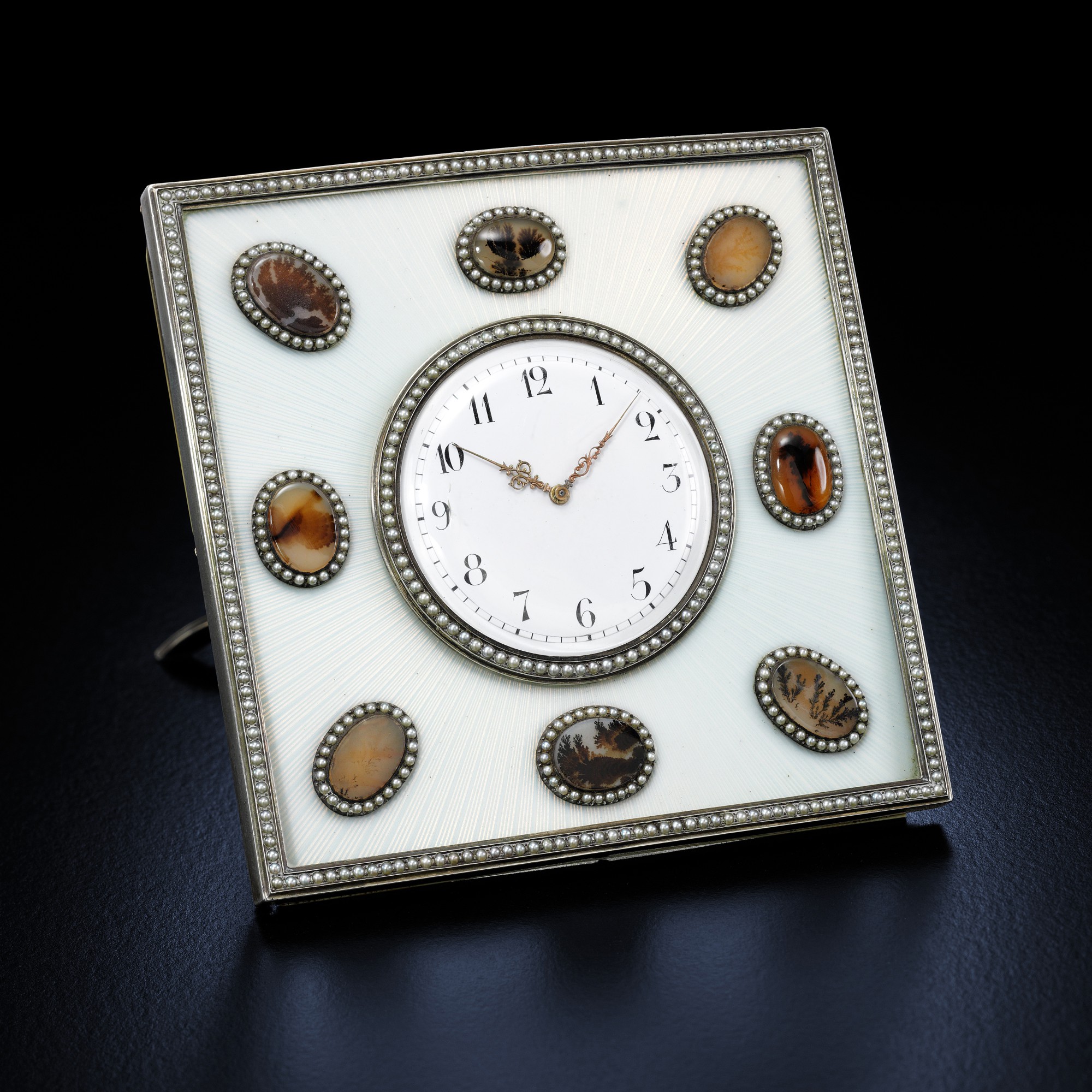 A Fabergé silver-mounted guilloché enamel and dendritic agate desk clock, workmaster Michael Perkhin, St Petersburg, circa 1890 — A Fabergé silver-mounted guilloché enamel and dendritic agate desk clock, workmaster Michael Perkhin, St Petersburg, circa 1890