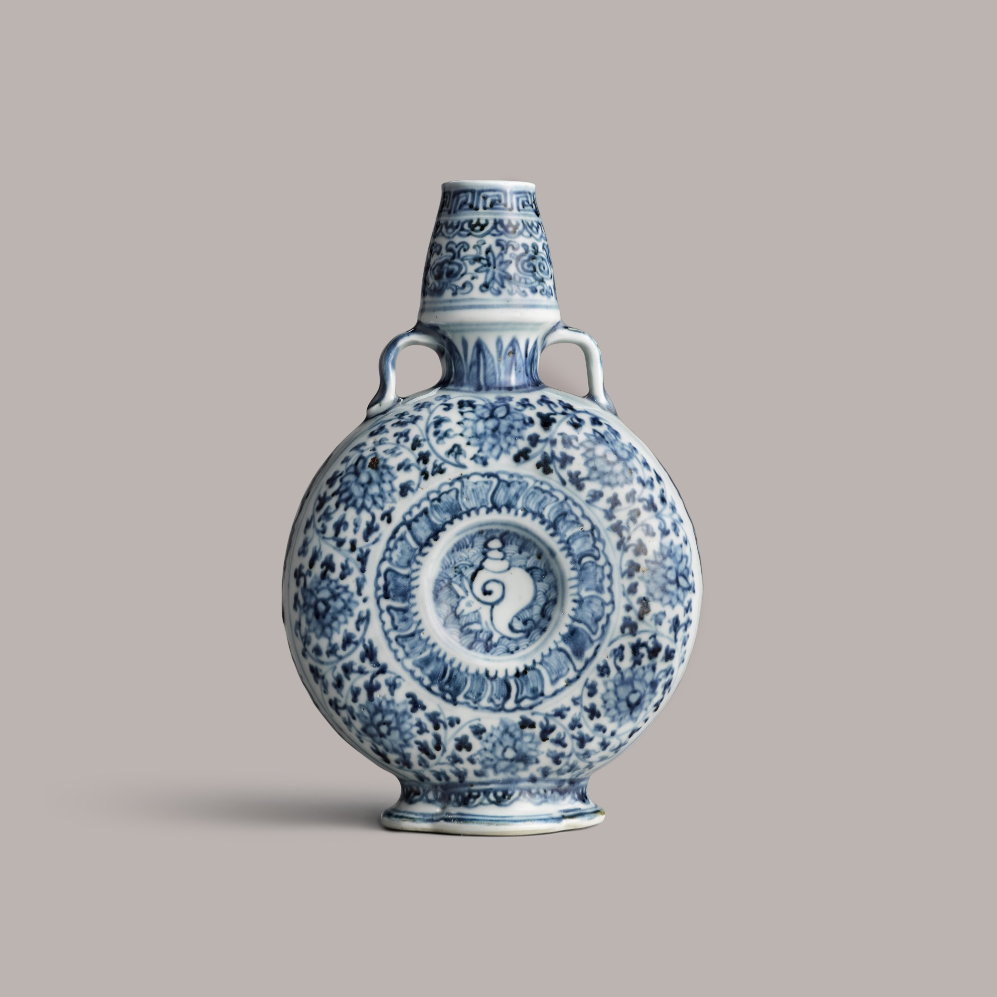 A blue and white moon flask — 明 青花玉兔纏枝花卉紋抱月瓶