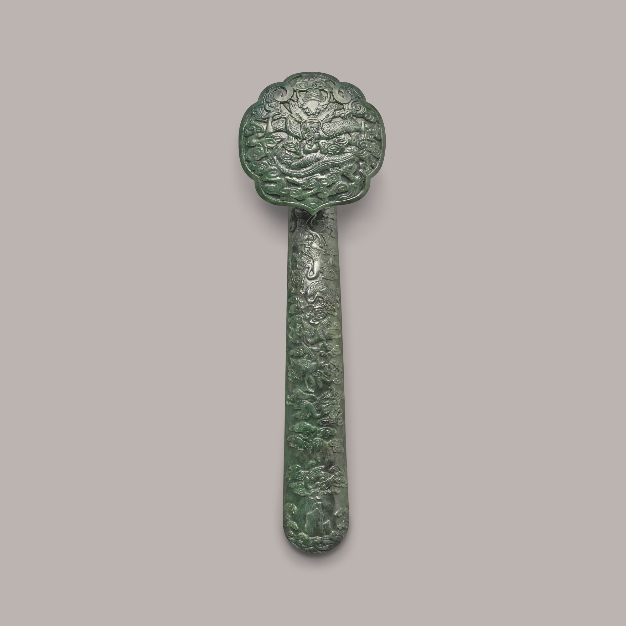 A large spinach jade ruyi sceptre — 晚清 碧玉八吉祥仙鶴紋如意
