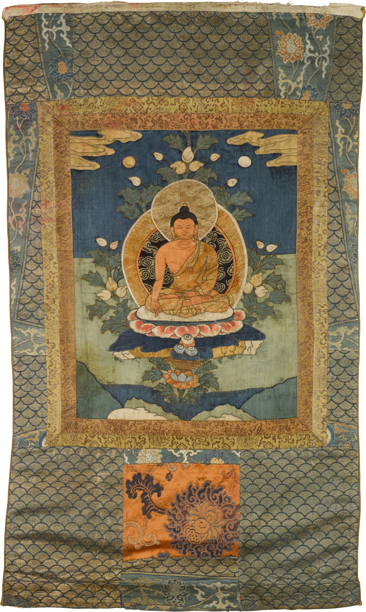 An appliqué thangka depicting Ratnasambhava — 西藏十八/十九世紀 刺綉寶生佛唐卡