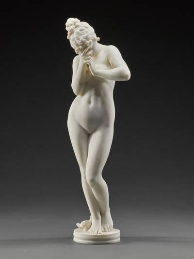 Girl crying over a fallen lamp