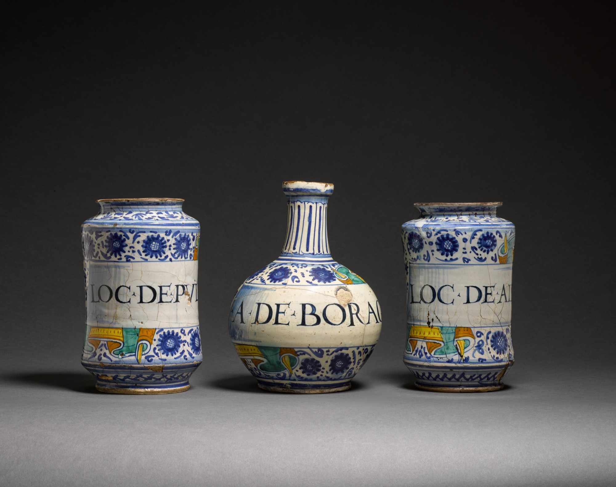Unknown — A pair of Italian maiolica albarelli and a bottle, Faenza, circa 1525
