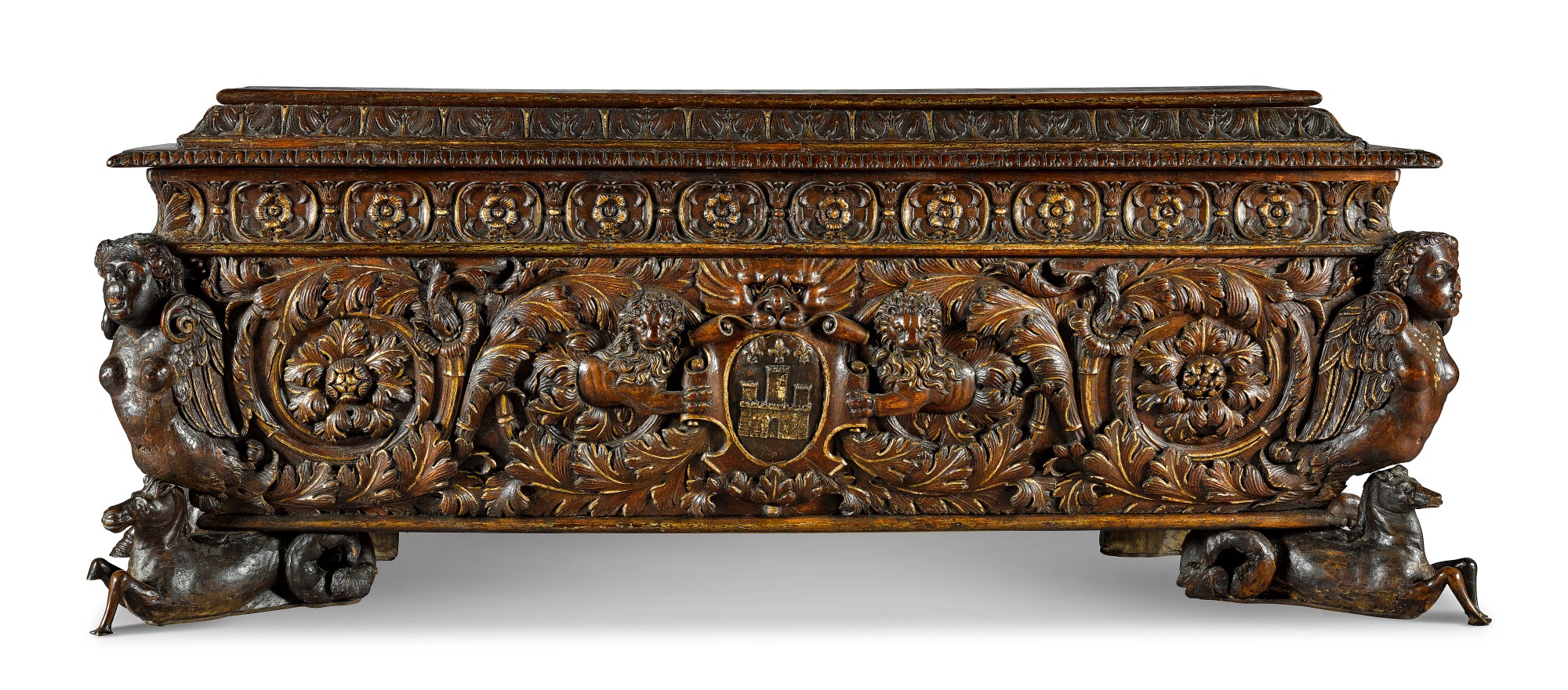 An Italian carved and parcel-gilt walnut cassone — An Italian carved and parcel-gilt walnut cassone