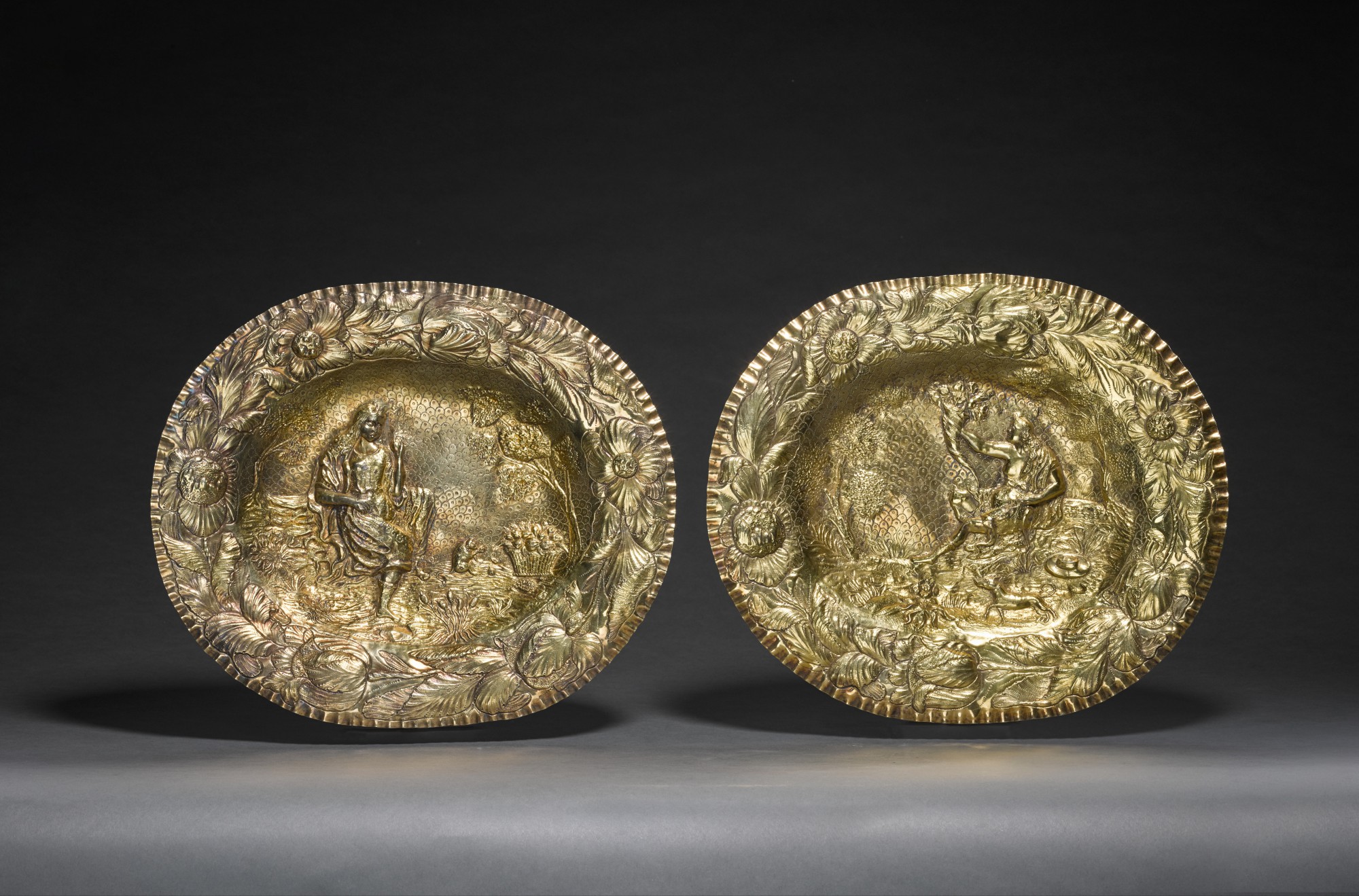 Unknown — A pair of Germanic silver-gilt dishes, unmarked, possibly mid-17th century