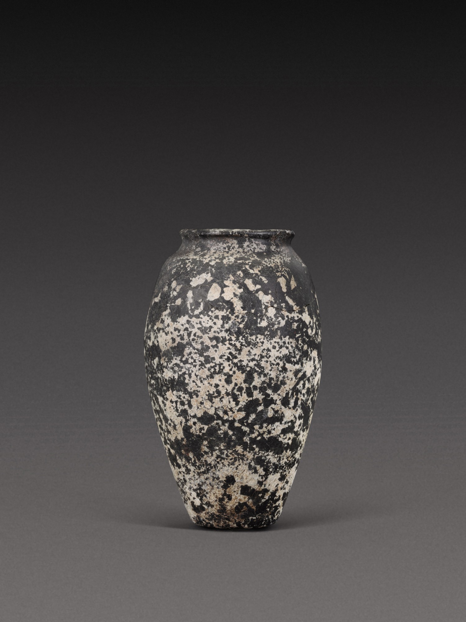 An Egyptian Porphyritic Diorite Jar — An Egyptian Porphyritic Diorite Jar, late Predynastic Period/2nd Dynasty, circa 3400-2750 B.C.
