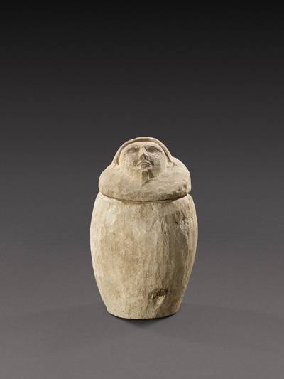 An Egyptian Limestone Canopic Jar