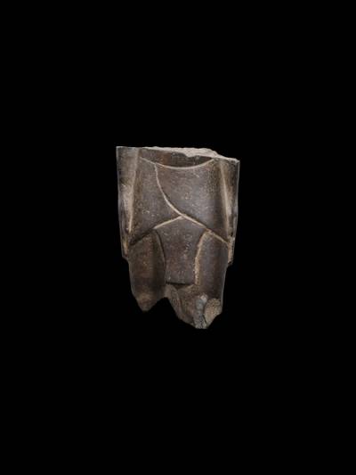 An Egyptian Basalt Torso of a Man, 26th/30th Dynasty, 664-342 B.C.