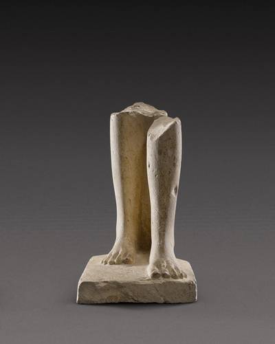 An Egyptian Limestone Statue Fragment