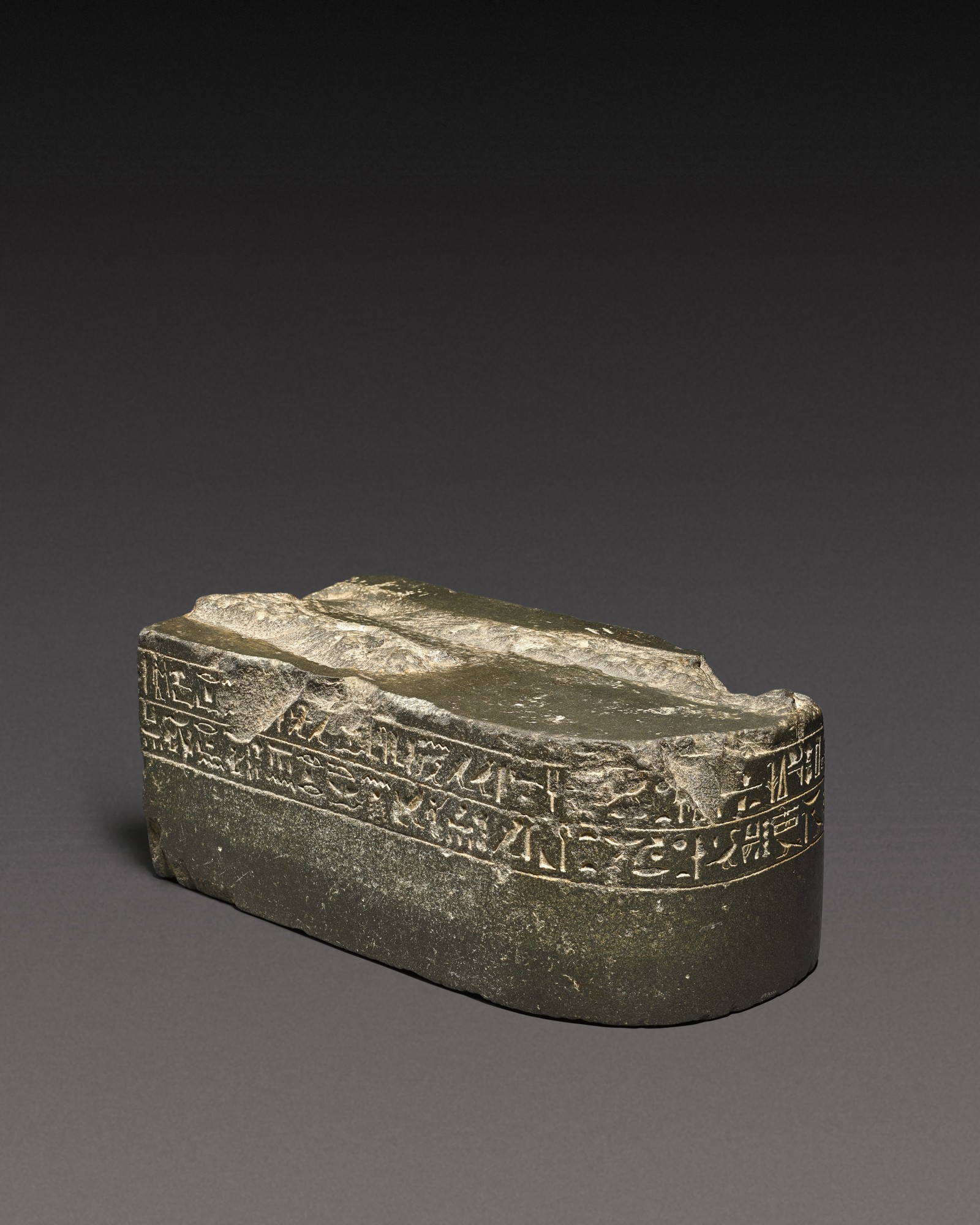 An Egyptian Greywacke Inscribed Statue Base — An Egyptian Greywacke Inscribed Statue Base, Late Period, 712-30 B.C
