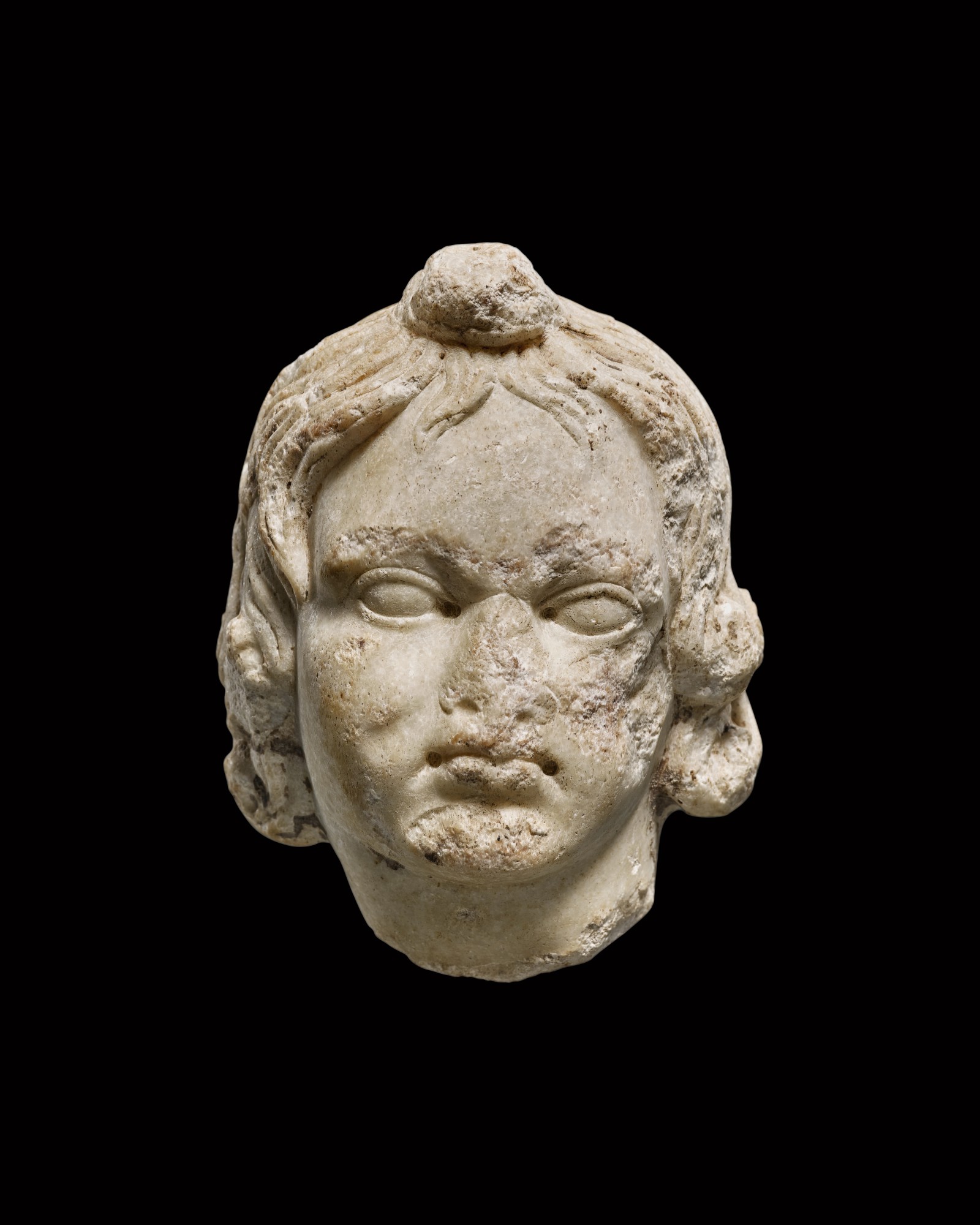 A Roman Marble Head of a Boy or Eros — A Roman Marble Head of a Boy or Eros, circa 1st/2nd Century A.D.
