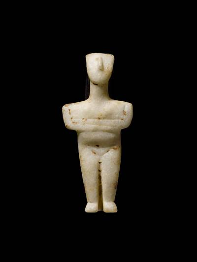 A Cycladic Marble Figure of a Goddess, Early Bronze Age II, circa 2600-2400 B.C