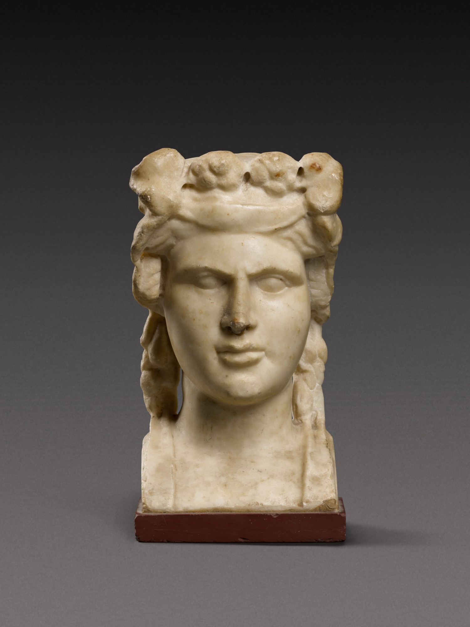 A Roman Marble Herm Bust of the Young Dionysos, circa 1st Century A.D.