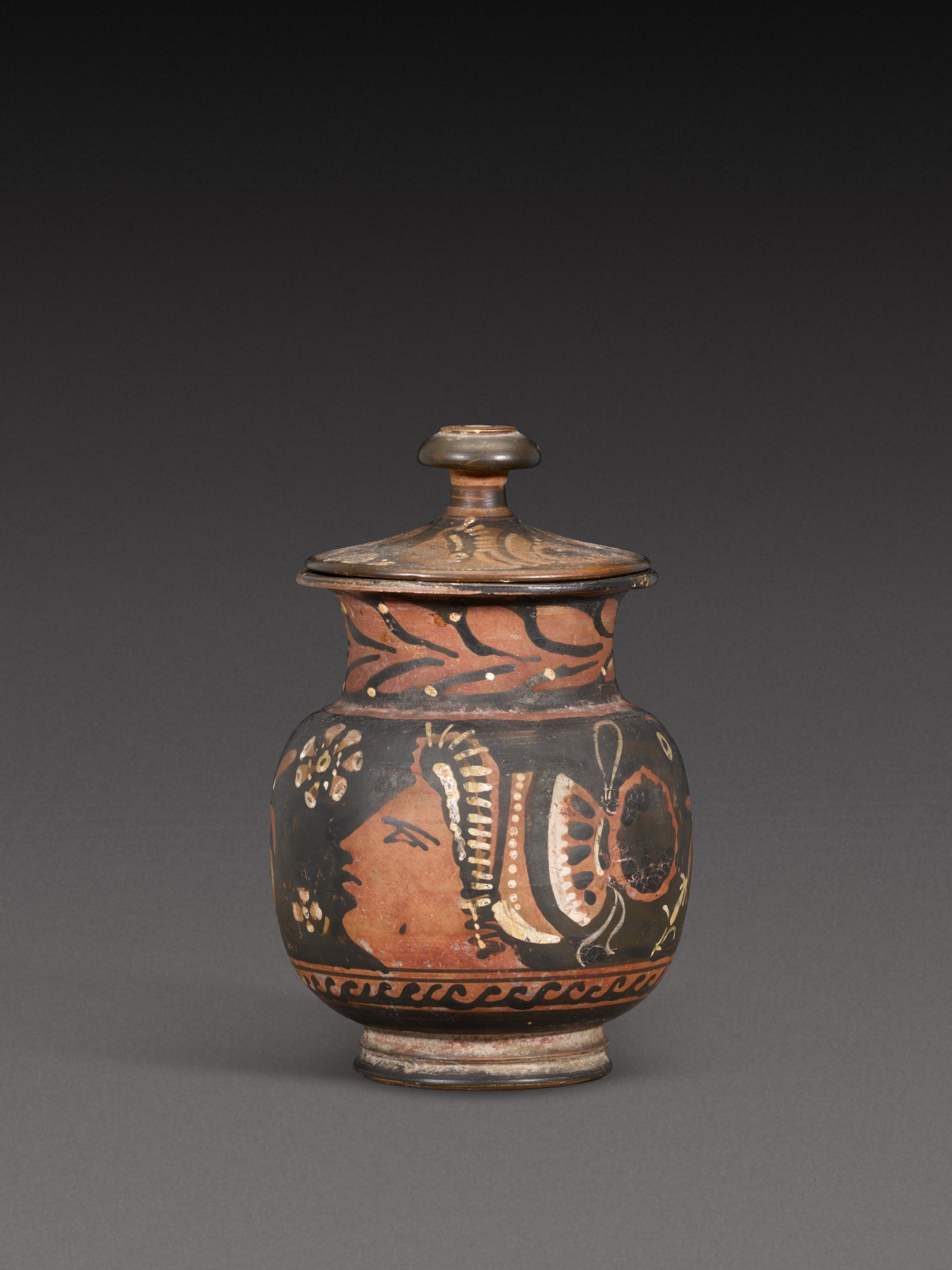 B.c. — An Apulian Red-figured Mug and Lid, circa 350-330 B.C.