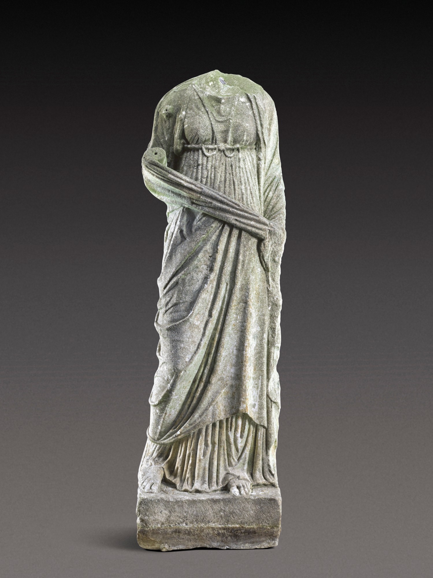 A Roman Marble Figure of a Woman — A Roman Marble Figure of a Woman, circa 2nd Century A.D.