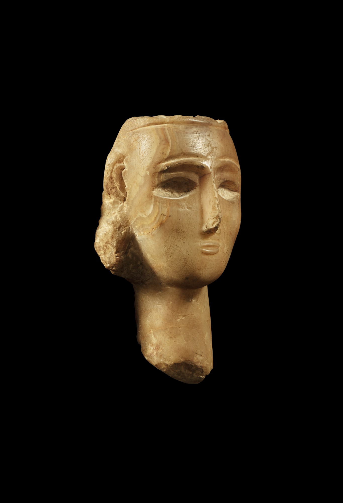 A South Arabian Alabaster Head of a Woman, Qataban — A South Arabian Alabaster Head of a Woman, Qataban, 3rd Century B.C./1st Century A.D.