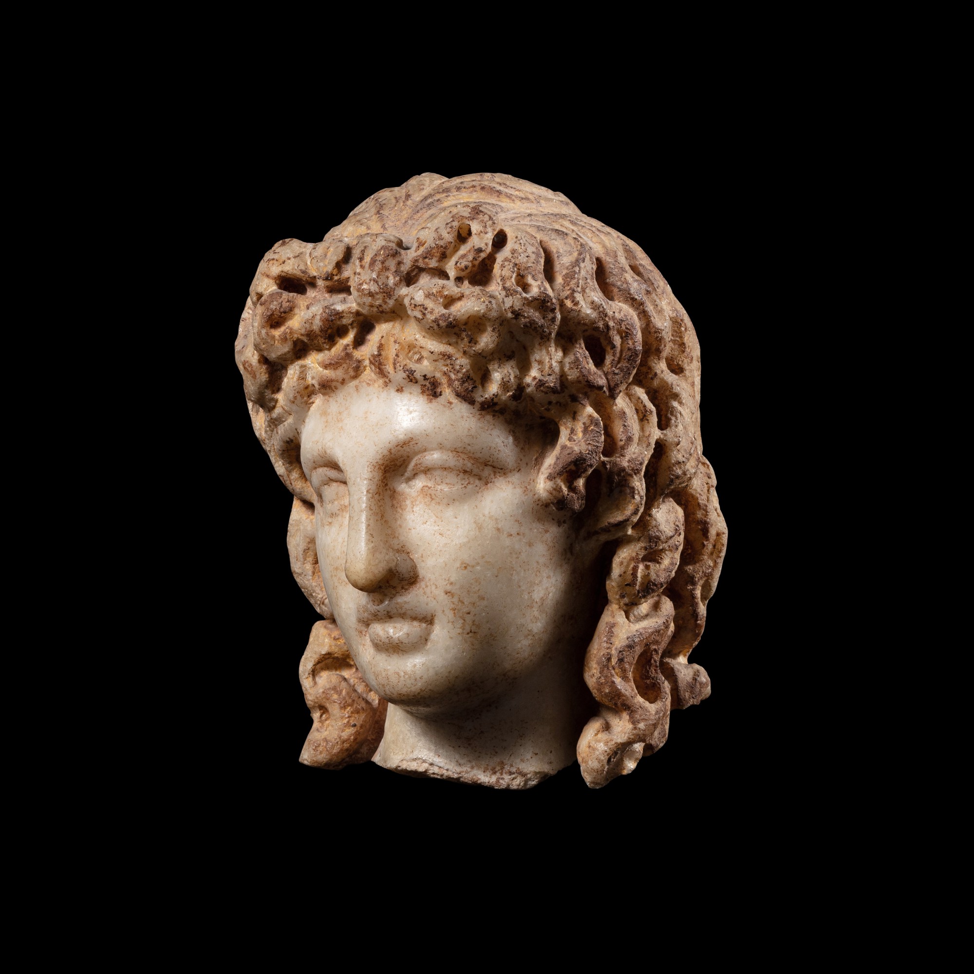 A Roman Marble Head of the Eros of Centocelle — A Roman Marble Head of the Eros of Centocelle, circa 2nd Century A.D.
