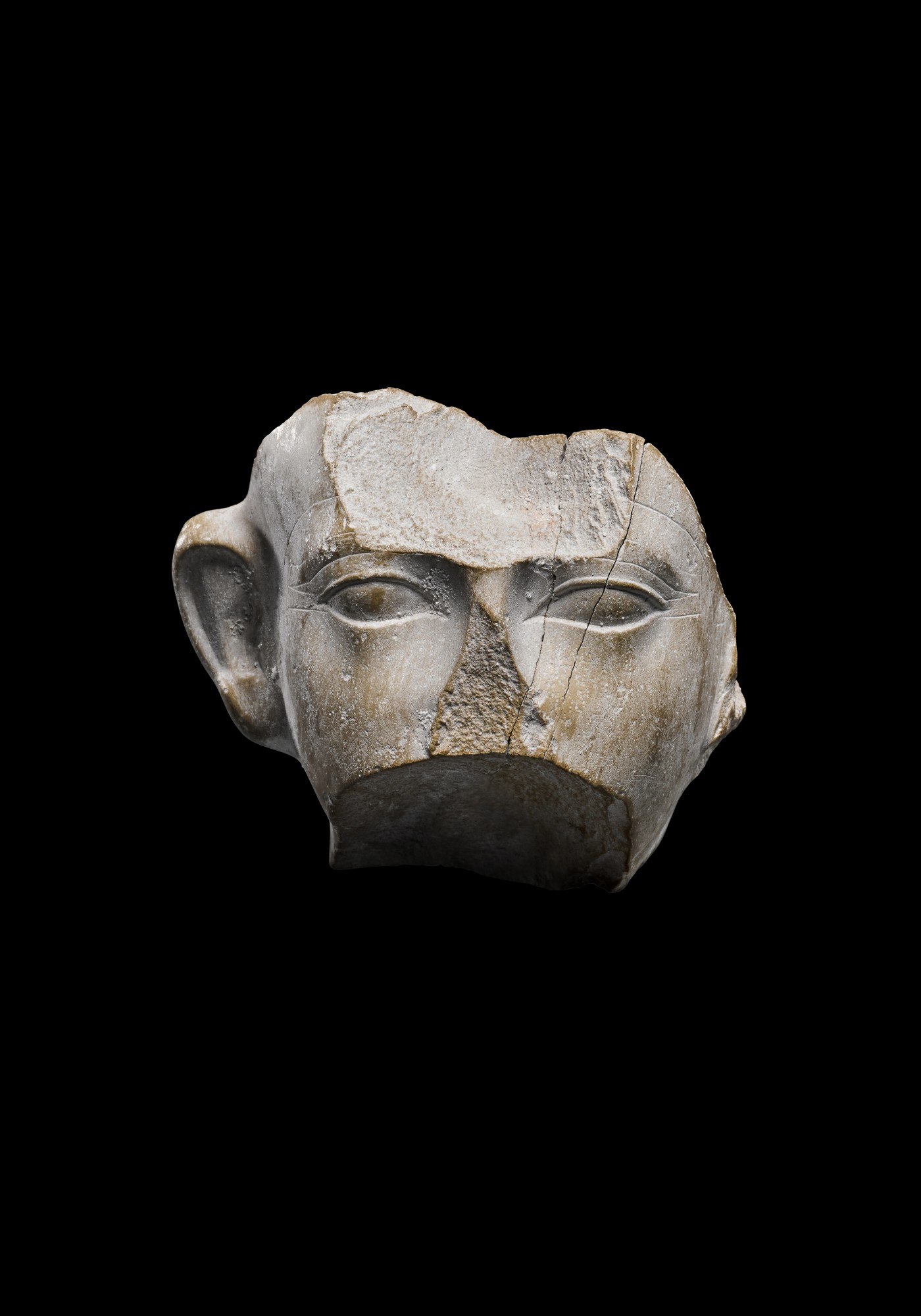A Fragmentary Egyptian Indurated Limestone Head of Amenemhat III — A Fragmentary Egyptian Indurated Limestone Head of Amenemhat III, 12th Dynasty, period of Amenemhat III, 1818-1772 B.C.