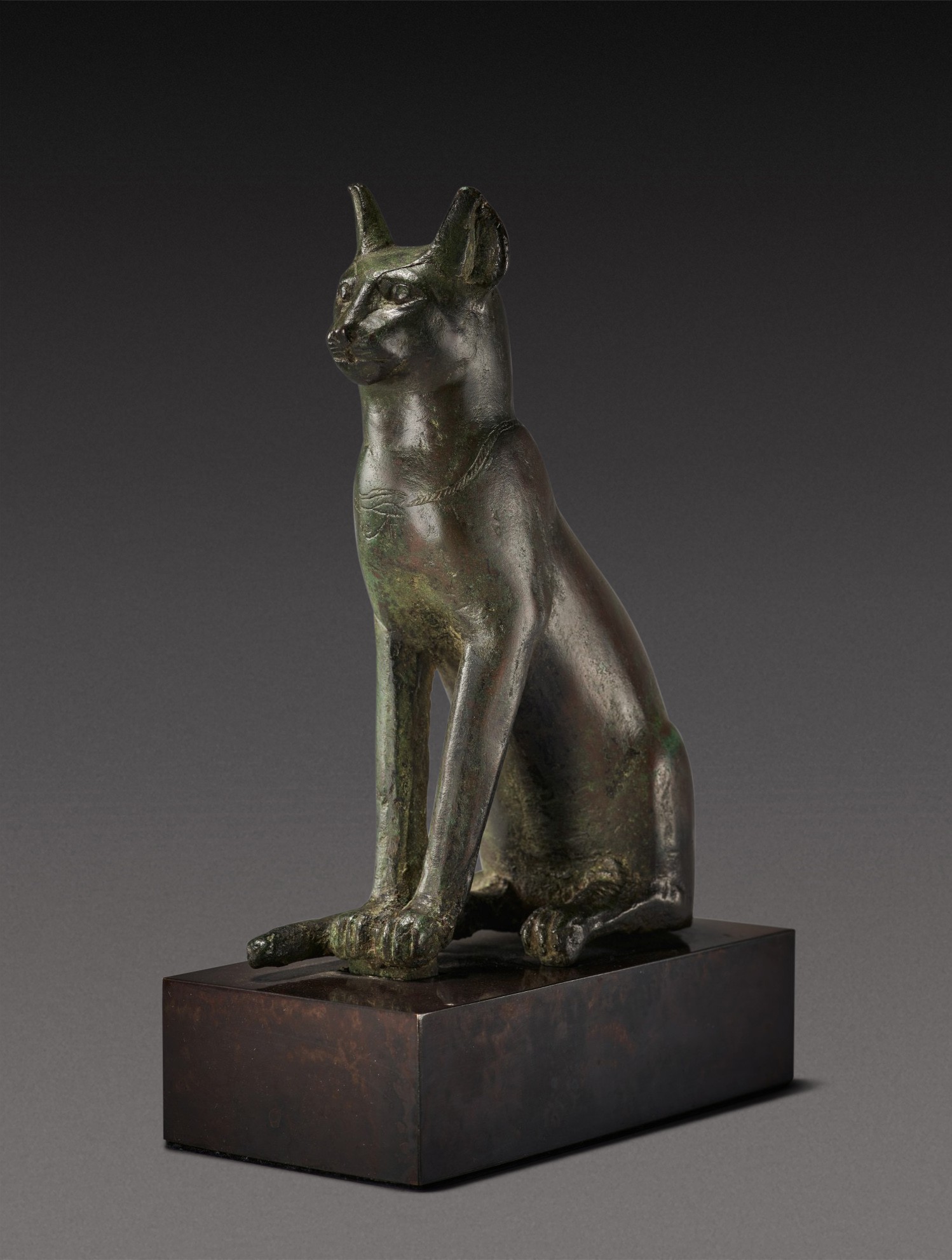 An Egyptian Bronze Figure of a Cat — An Egyptian Bronze Figure of a Cat, 26th/30th Dynasty, 664-342 B.C.