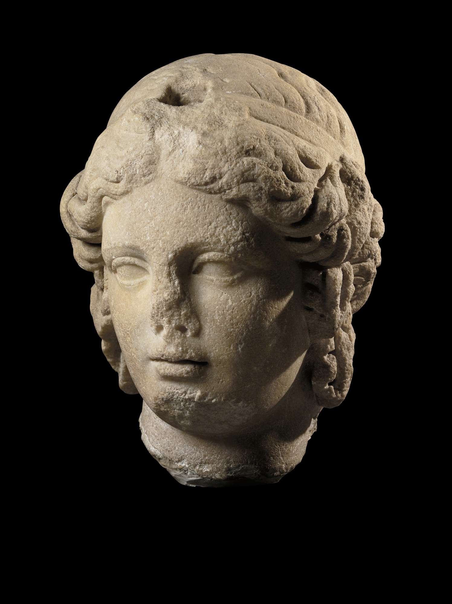 A Marble Head of the Goddess Isis — A Marble Head of the Goddess Isis, Roman Imperial, 2nd Century A.D., probably from Egypt