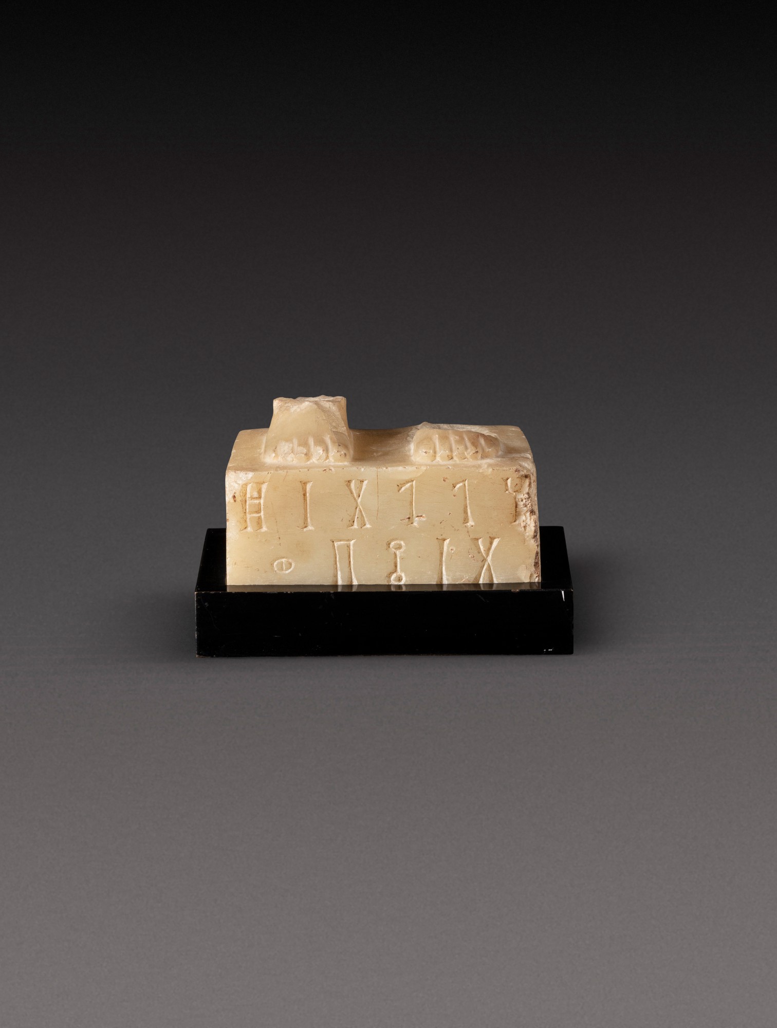 A South Arabian Alabaster Base of a Statuette, Qataban — A South Arabian Alabaster Base of a Statuette, Qataban, circa 1st Century A.D.