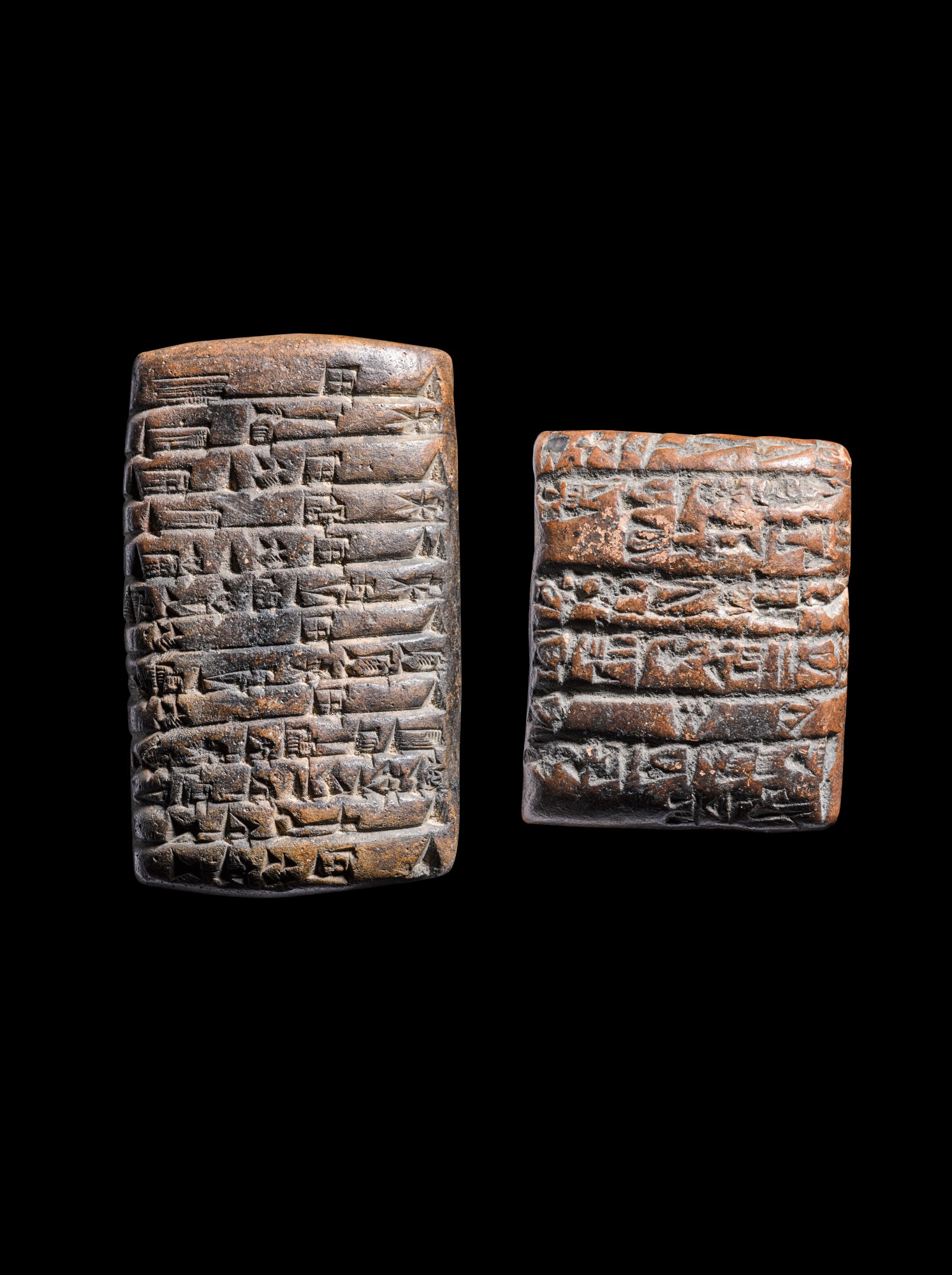Two Mesopotamian Clay Cuneiform Tablets