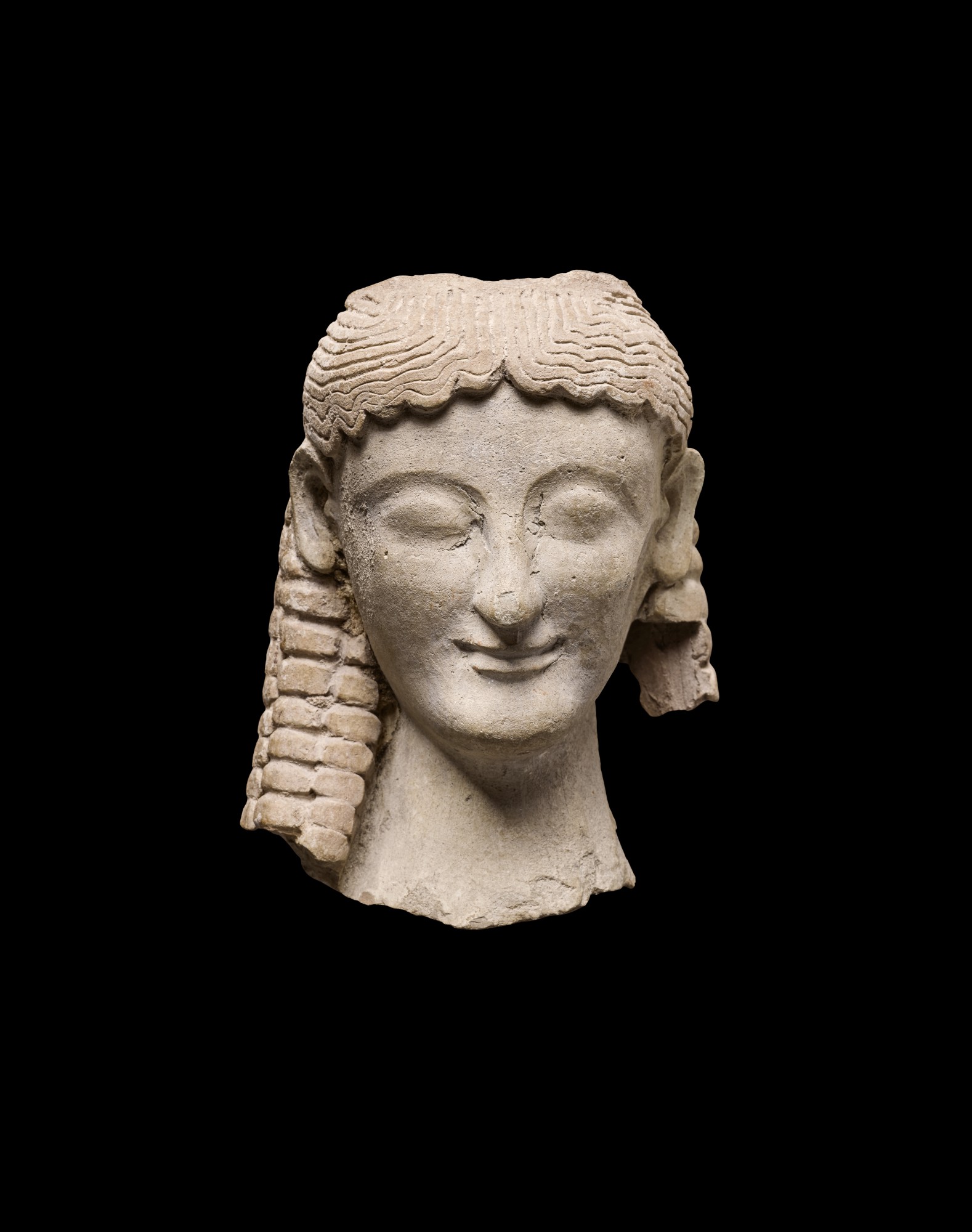 A Greek Terracotta Head of a Goddess — A Greek Terracotta Head of a Goddess, Magna Graecia circa late 6th/early 5th Century B.C