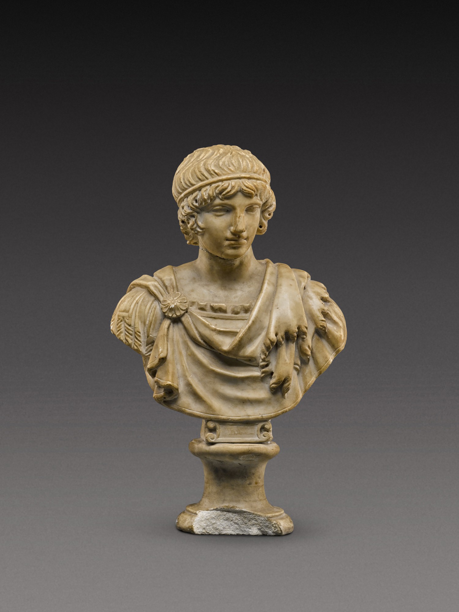 A Roman Marble Head of a Youth — A Roman Marble Head of a Youth, circa 2nd Century A.D., or later, on 17th/18th Century shoulders