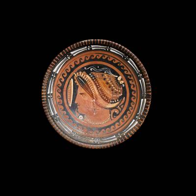 An Apulian Red-figured Pottery Plate