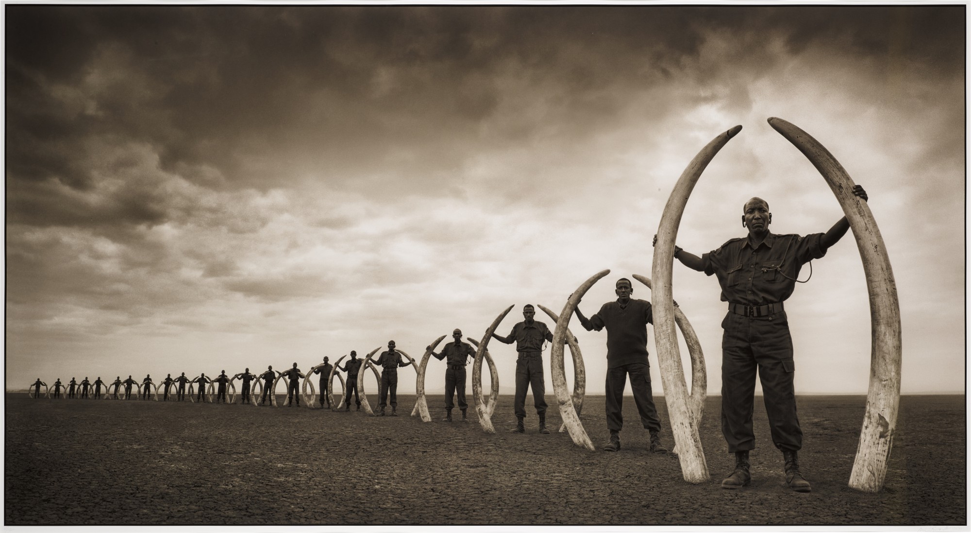 Nick Brandt — 'Rangers With Tusks Of Killed Elephants', Kenya, 2011