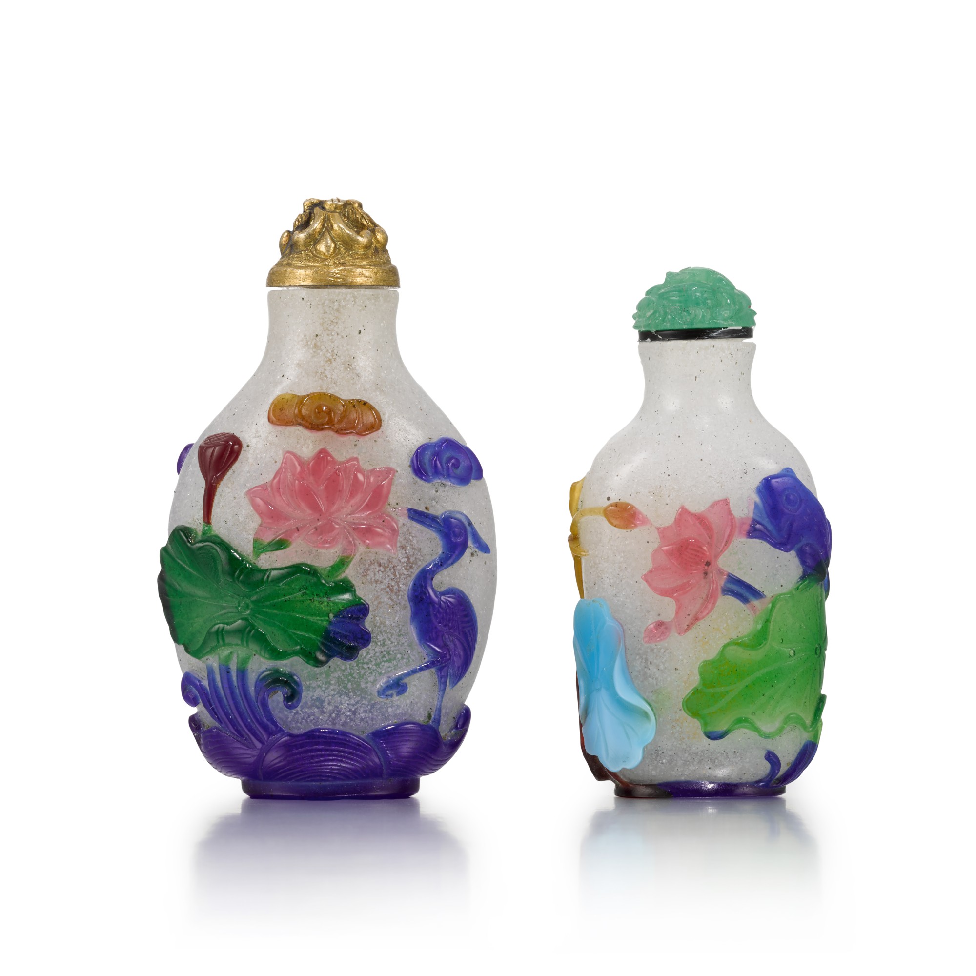 Two polychrome overlay white glass 'lotus pond' snuff bottles — 清十九世紀 套料荷塘紋鼻烟壺一組兩件