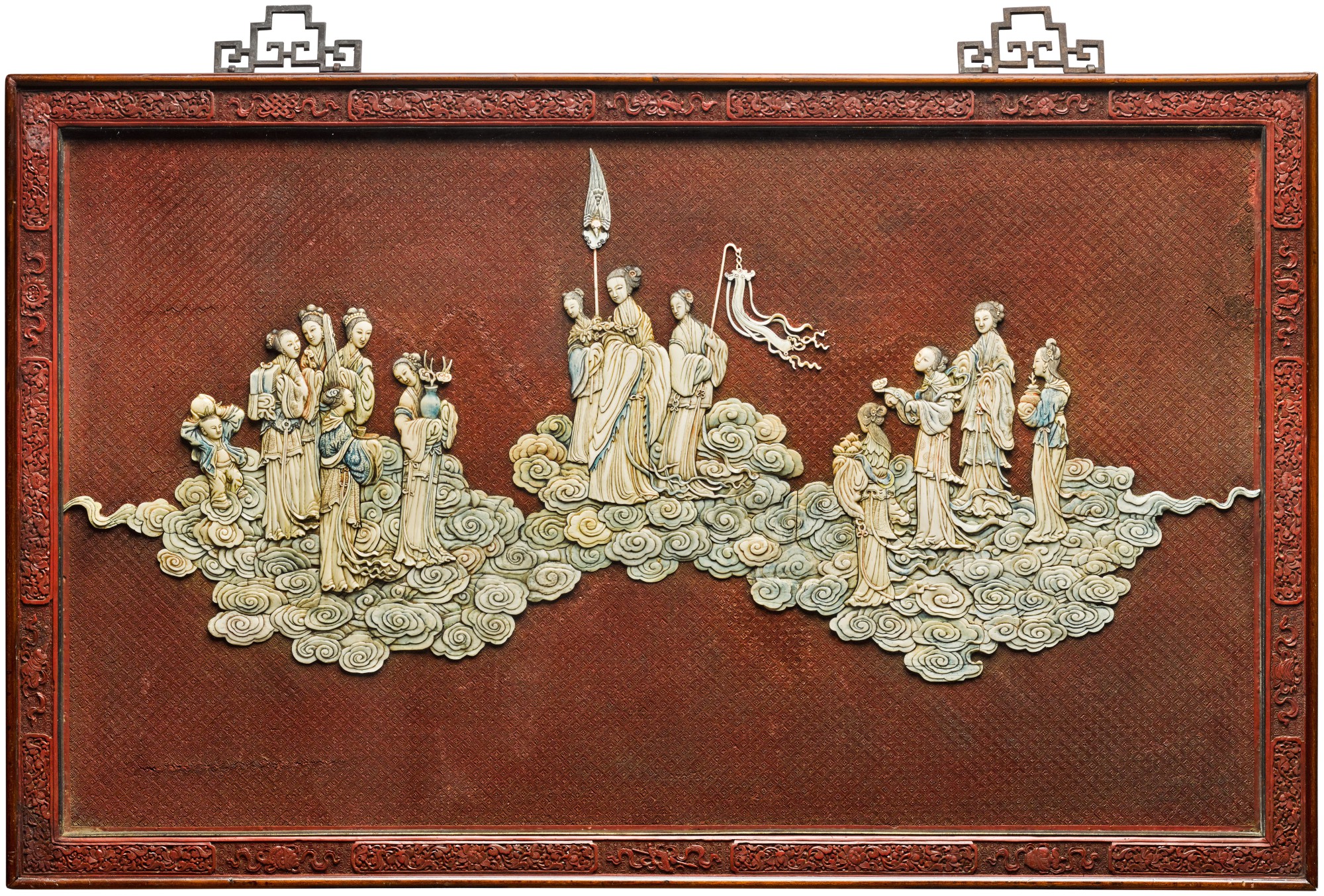 An ivory-embellished cinnabar lacquer ‘immortals' panel — 清乾隆 剔紅嵌象牙道教神仙圖掛屏