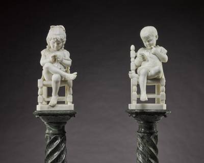 A Boy reading and a Girl sewing