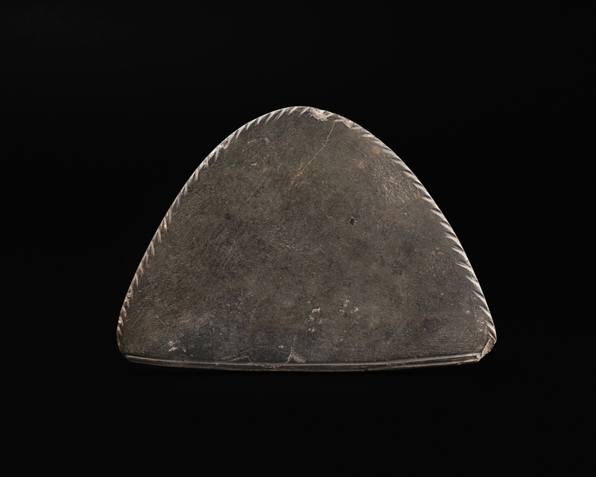 An Egyptian Greywacke Cosmetic Palette — An Egyptian Greywacke Cosmetic Palette, late Predynastic Period/1st Dynasty, circa 3200-2900 B.C.