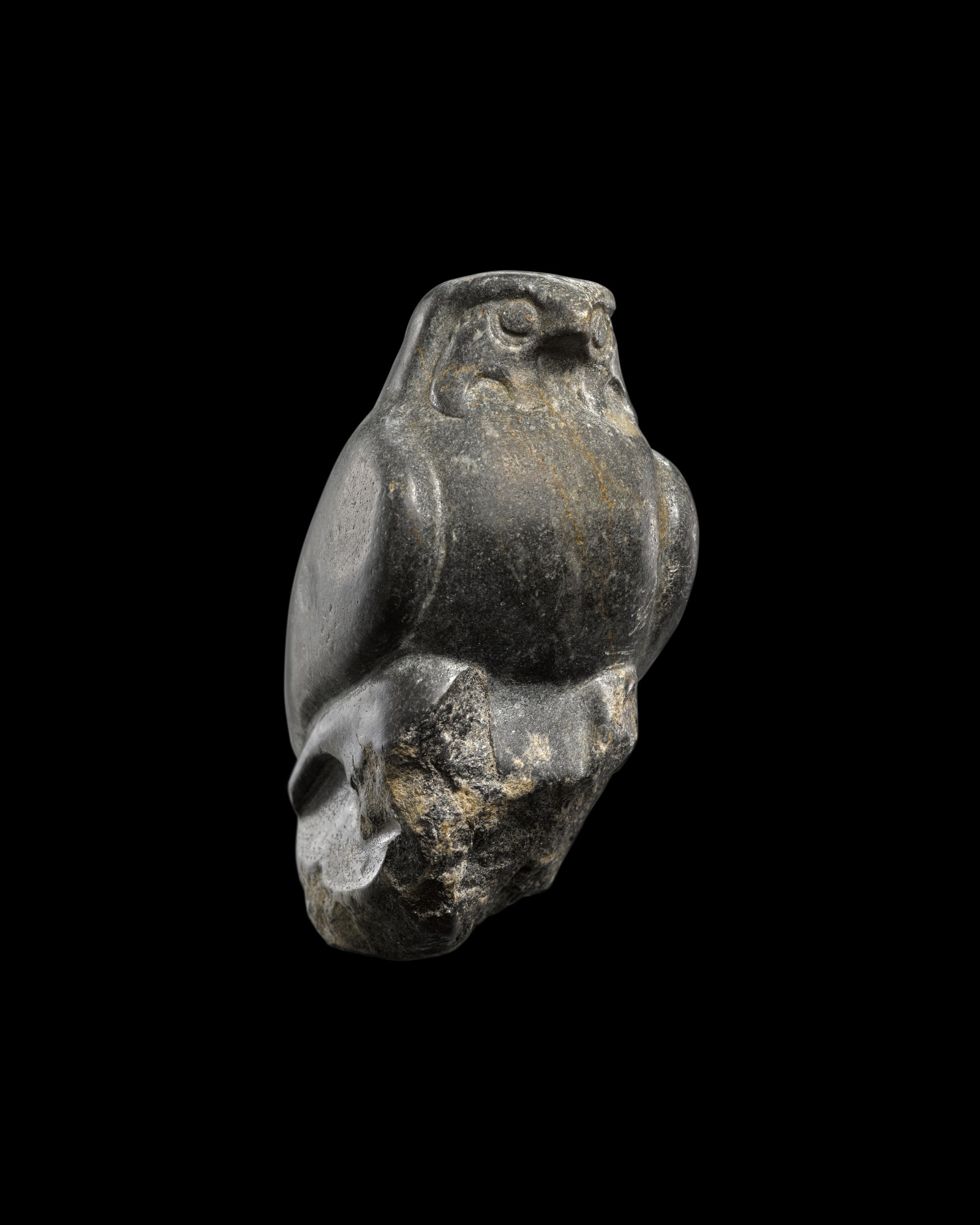A Fragmentary Egyptian Basalt Figure of a Falcon — A Fragmentary Egyptian Basalt Figure of a Falcon, Late Period, probably 30th Dynasty, 380-342 B.C.
