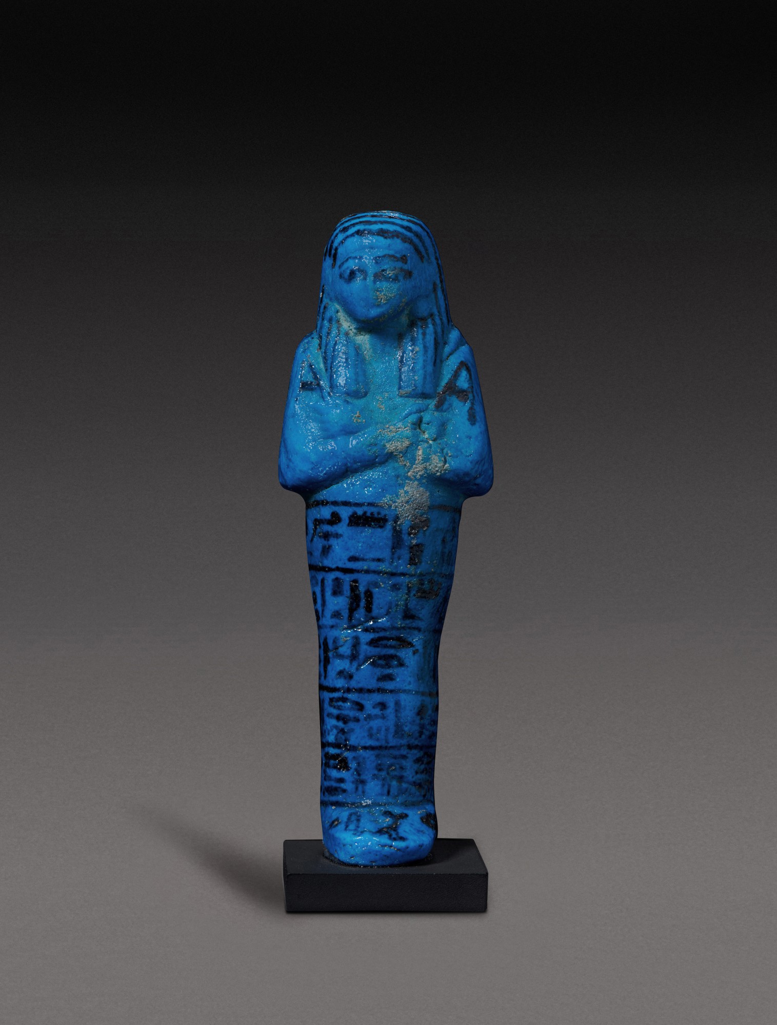 21st Dynasty, 1075-944 B.C — An Egyptian Brilliant Blue Faience Ushabti of Nesi-Khonsu, Principal Wife of the High Priest of Amun, Pinudjem II, 21st Dynasty, 1075-944 B.C
