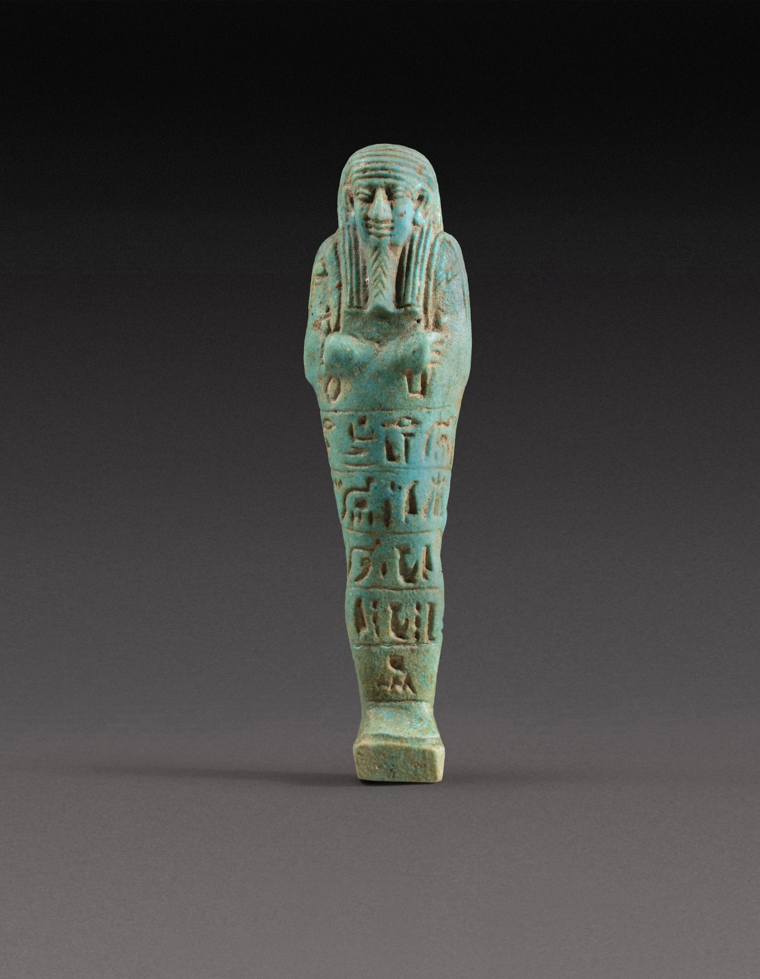 B.c. — An Egyptian Turquoise Faience Ushabti, 30th dynasty, 380-342 B.C.