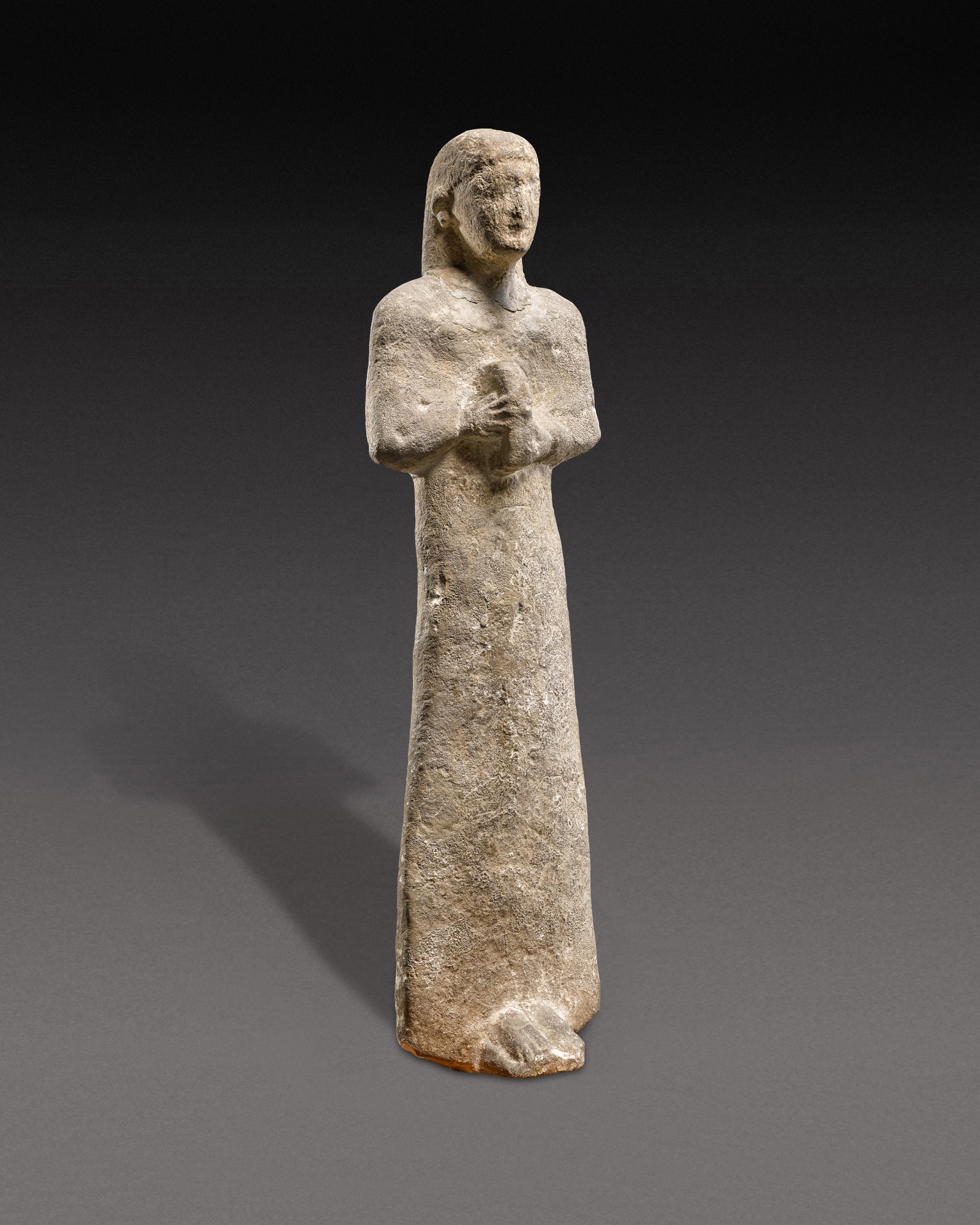 A Cypriot Limestone Votive Figure of a Musician, 2nd/3rd quarter of the 6th Century B.C.